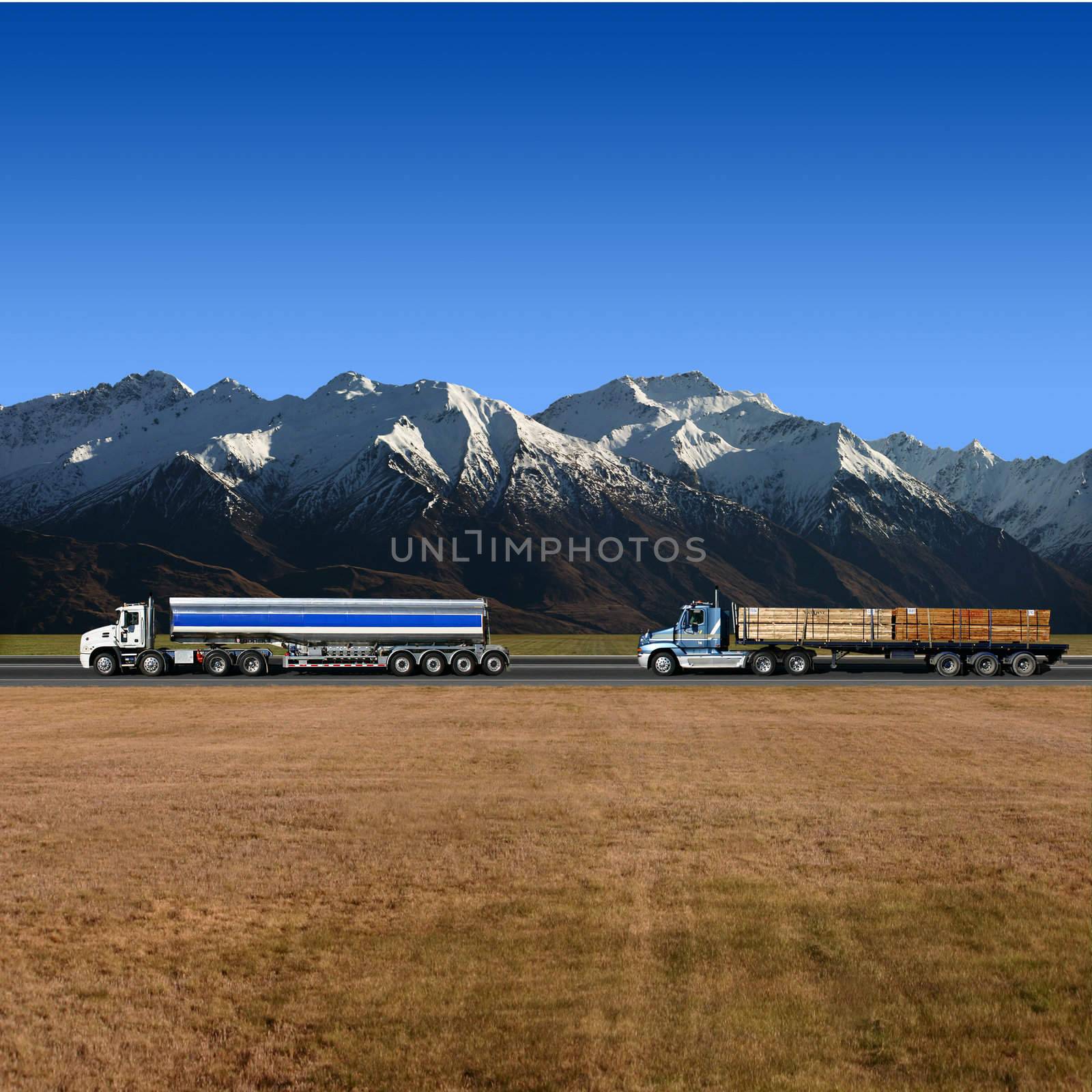 Two Trucks on Highway with Mountains