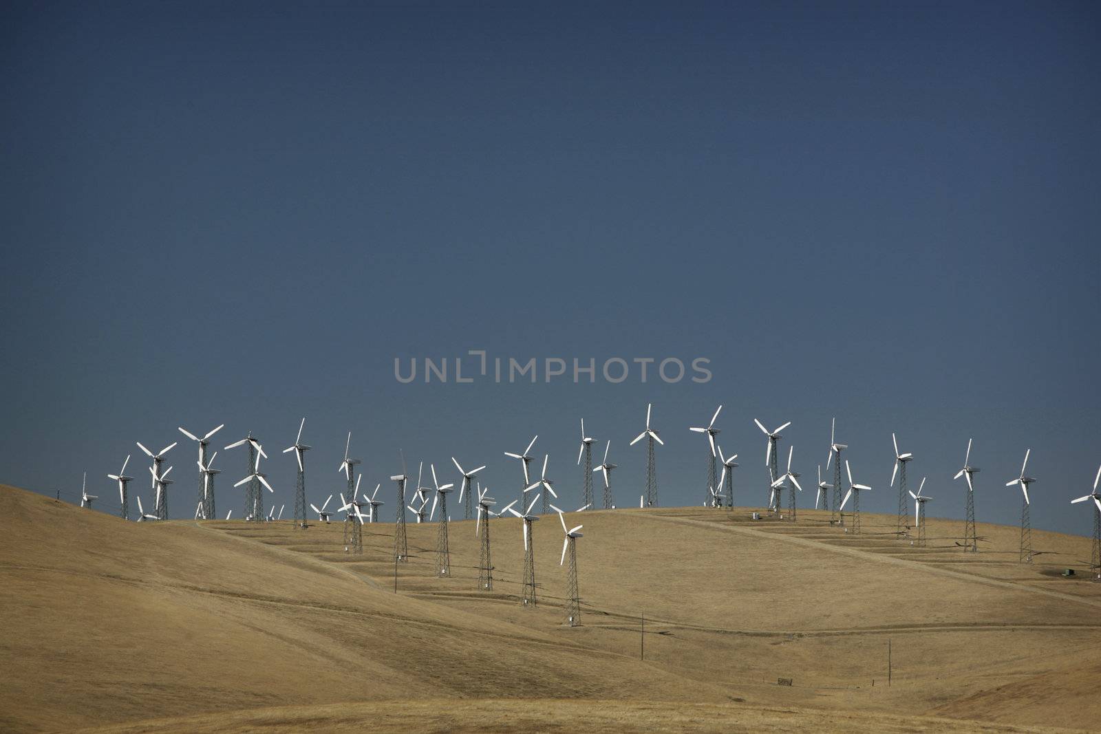 Windmill on a hill to generate electricity