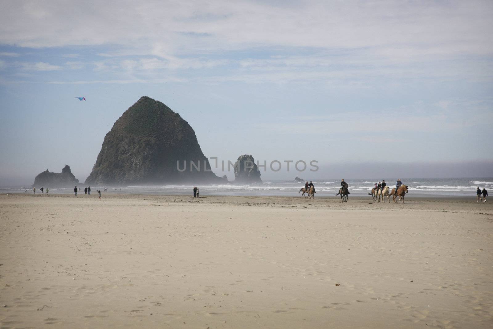 beach scene with people at the canon beach in oregon