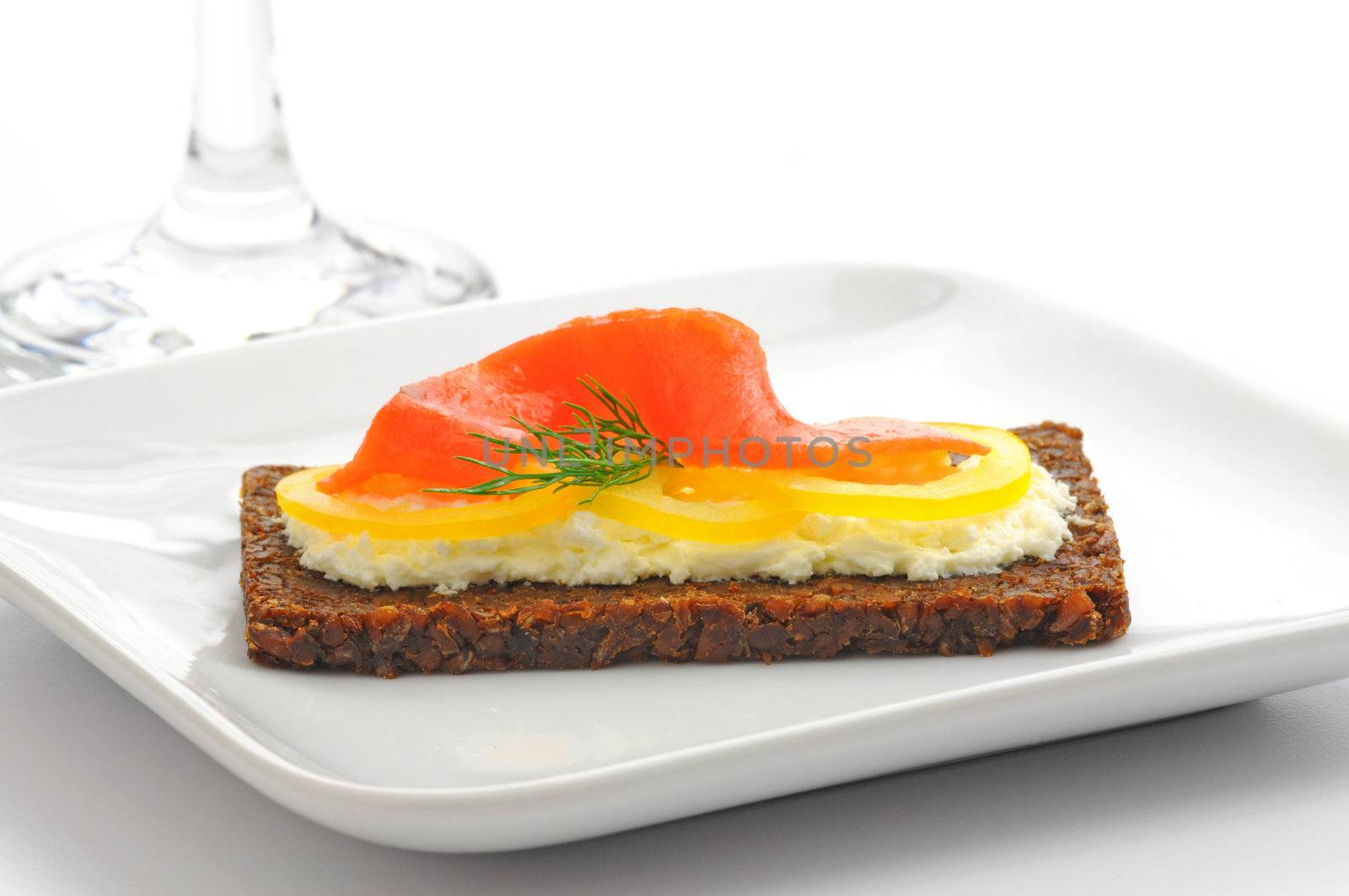 Appetizer of smoked salmon, cream cheese and dill.