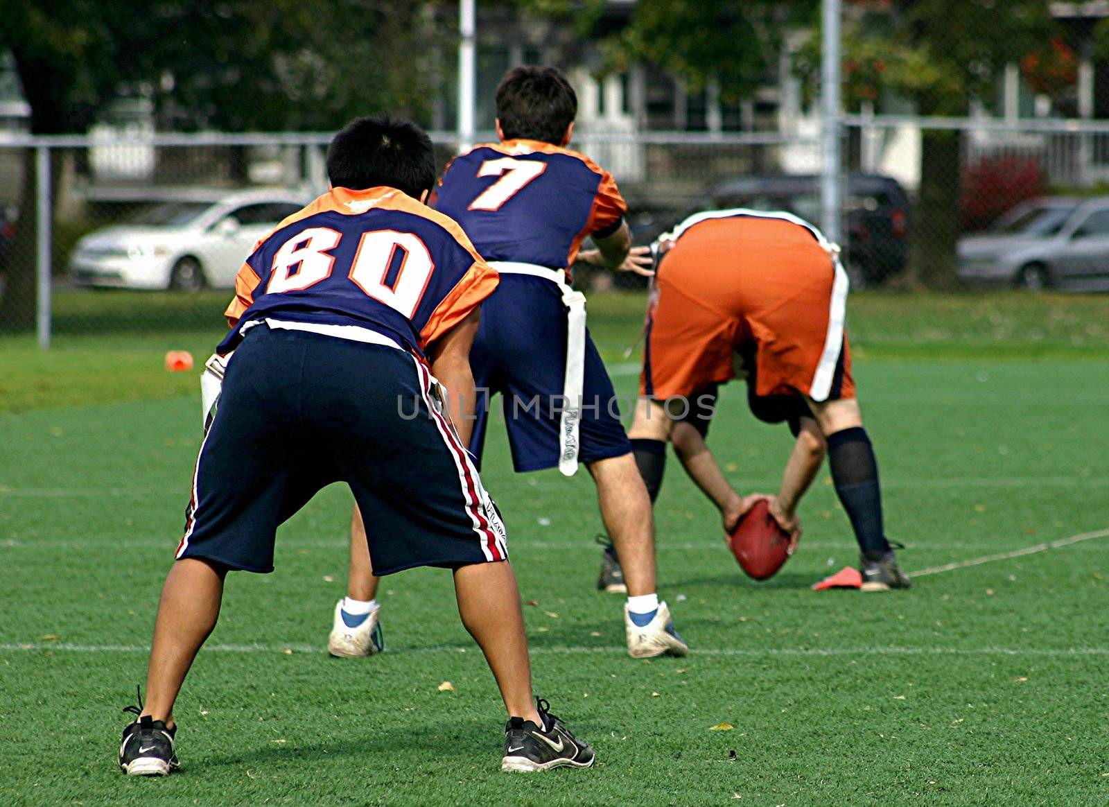 Young men getting ready to run a play in football