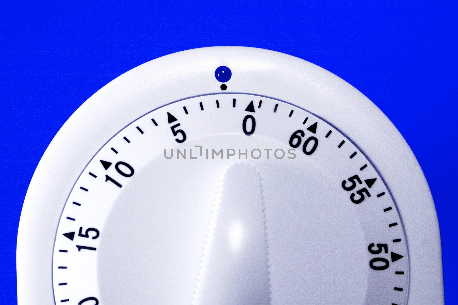 Nice clean photo of a timer showing only two minutes left. Can be used for themes related to time management, time constraints, time limit, or time limitation, including procrastination.