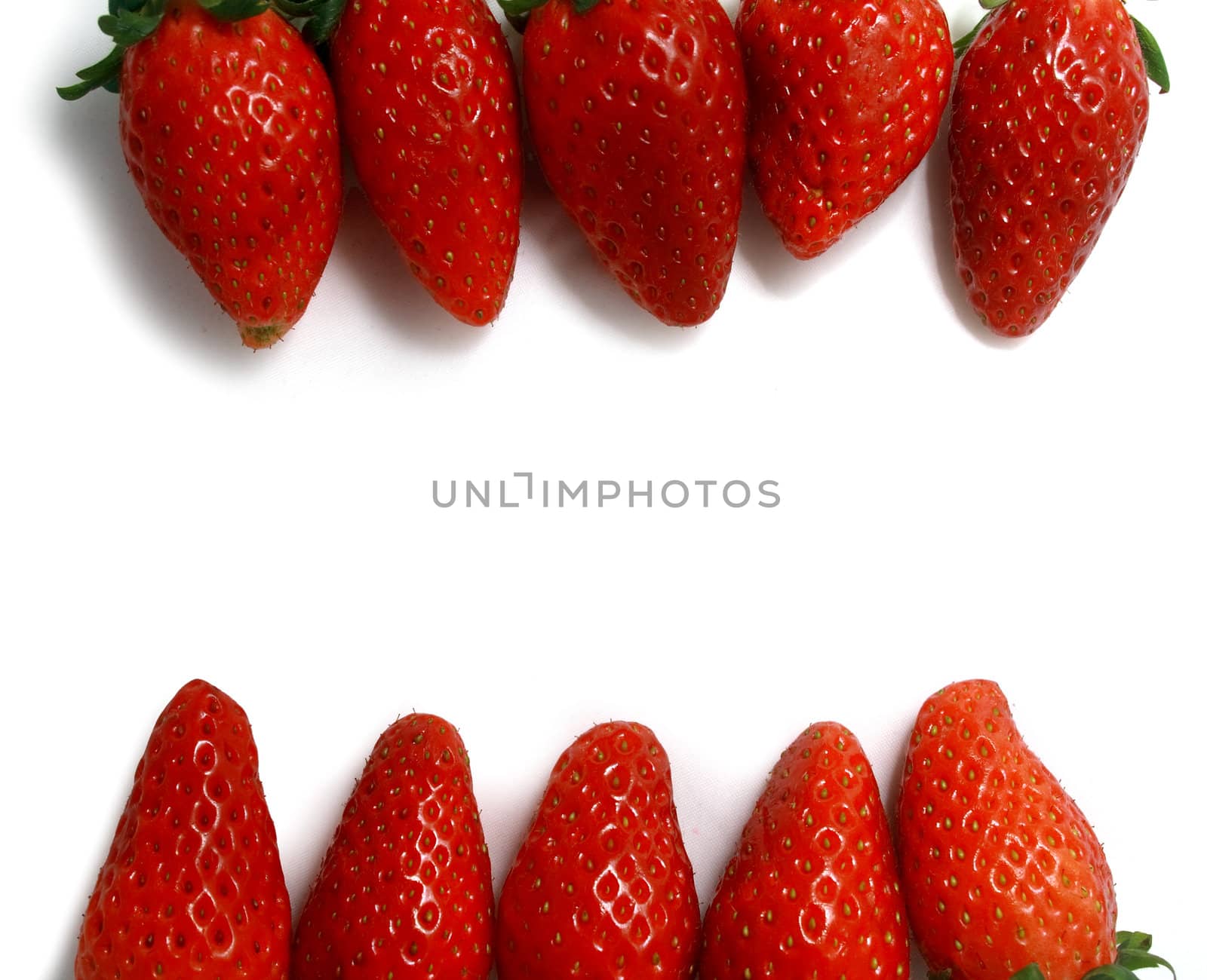 Brightly red strawberries on a white background form up a frame.