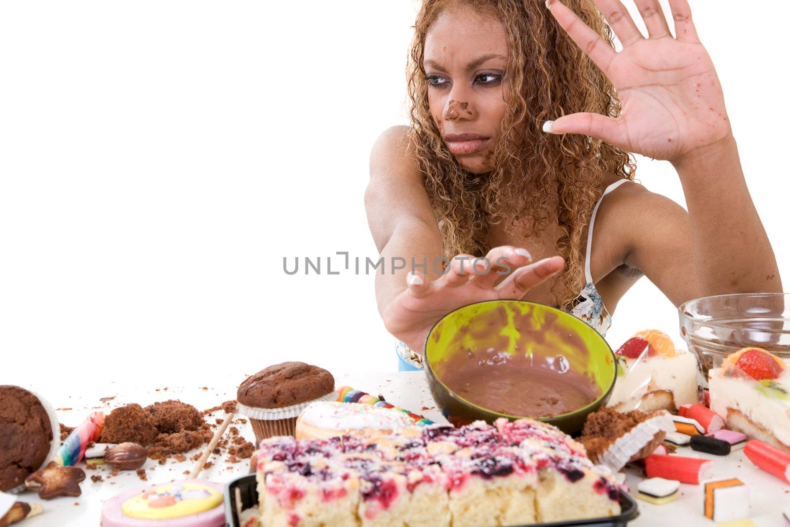 Pretty black girl pushing away the food she has just eaten