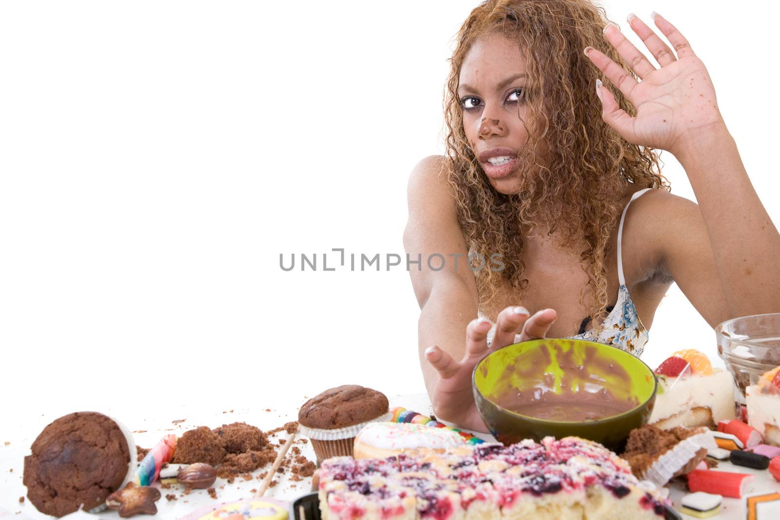 Pretty black girl pushing away the bowl of chocolate she has just been eating