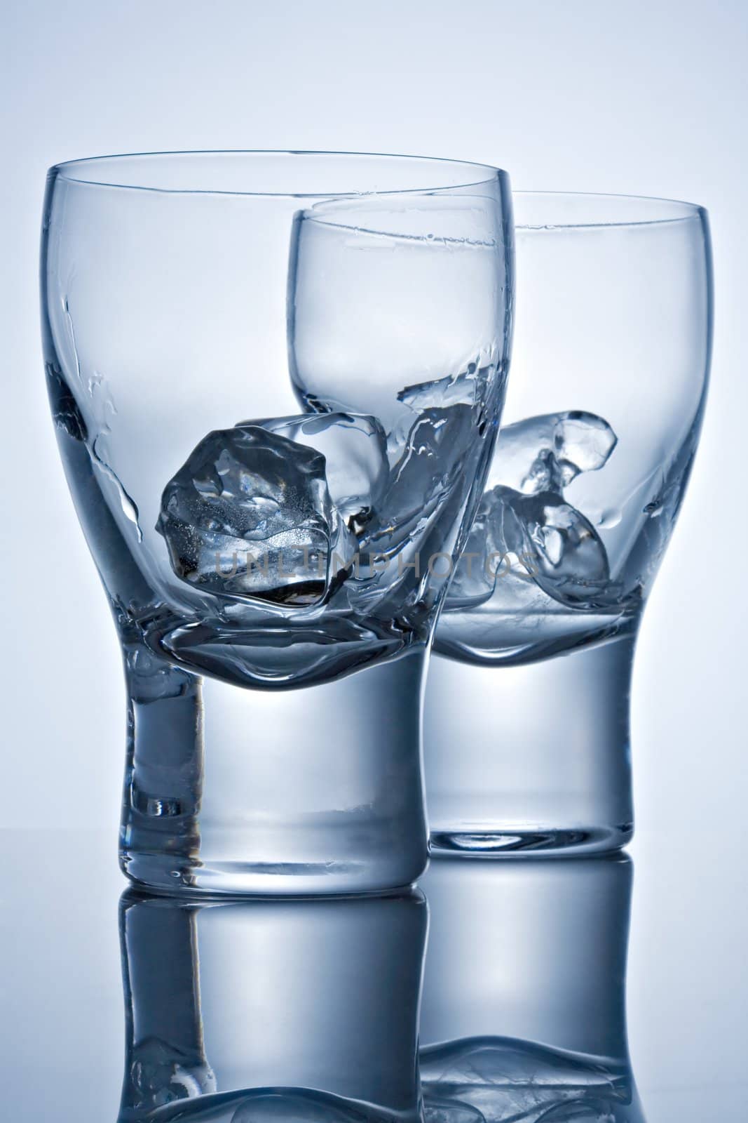 Two glasses with ice by Gravicapa