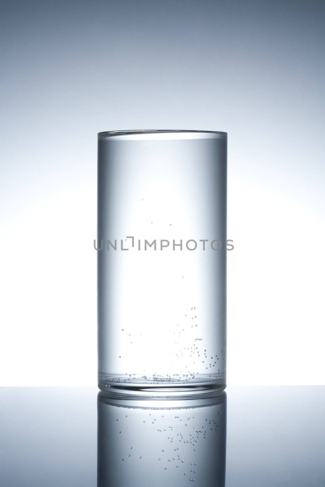 Empty glass close up on a mirror surface
