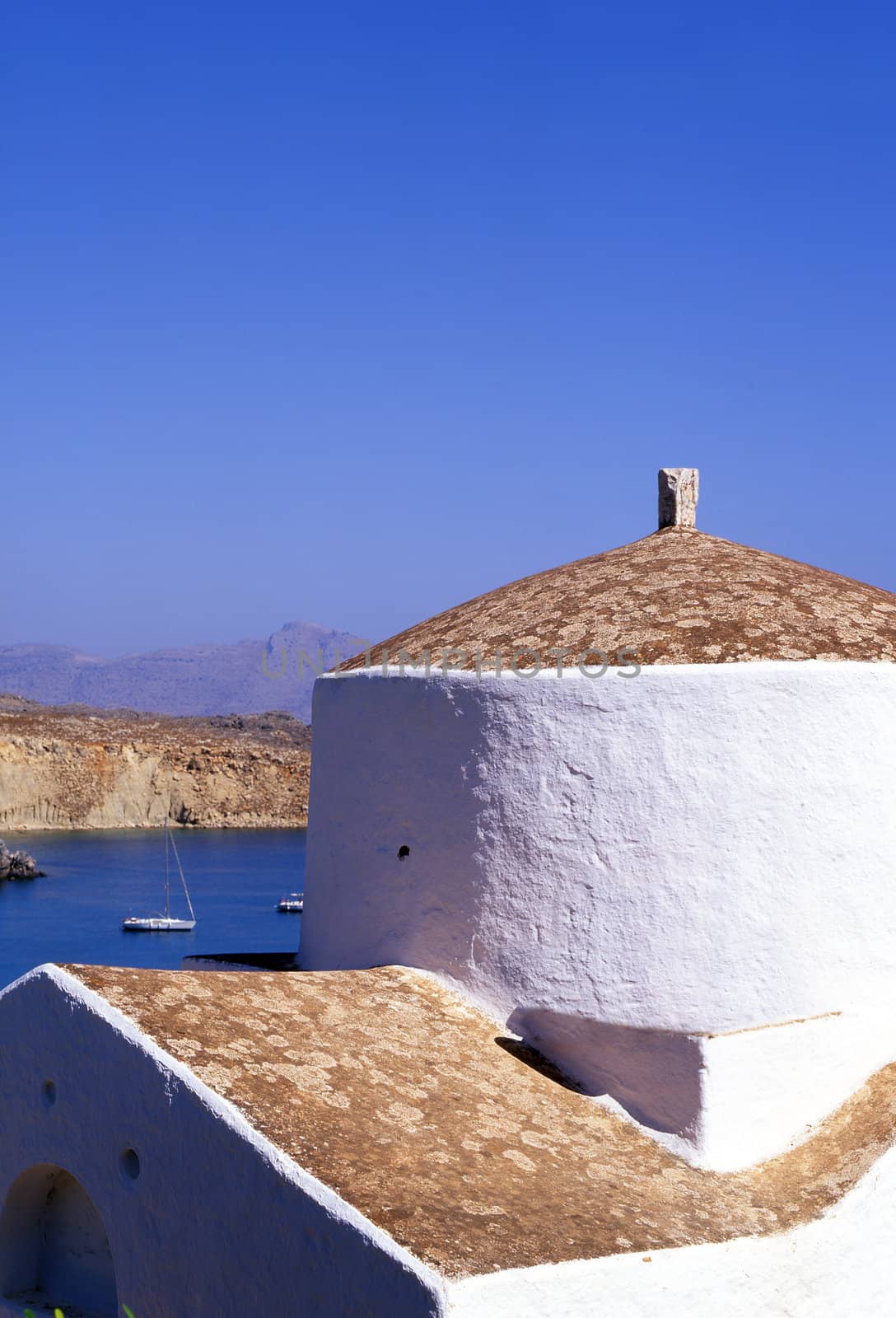 A greek church over looking the bay of Lindos on the island of Rhodes, Greece.