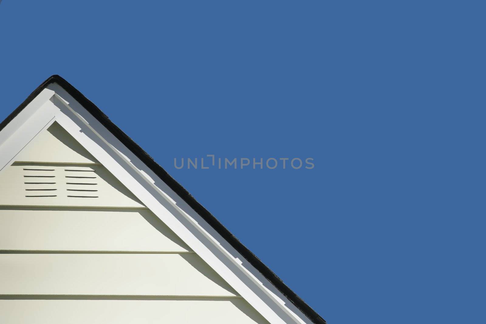 Home rooftop with lots of ad or message copy white space, can be used to advertise your roofing services, home remodeling, etc.