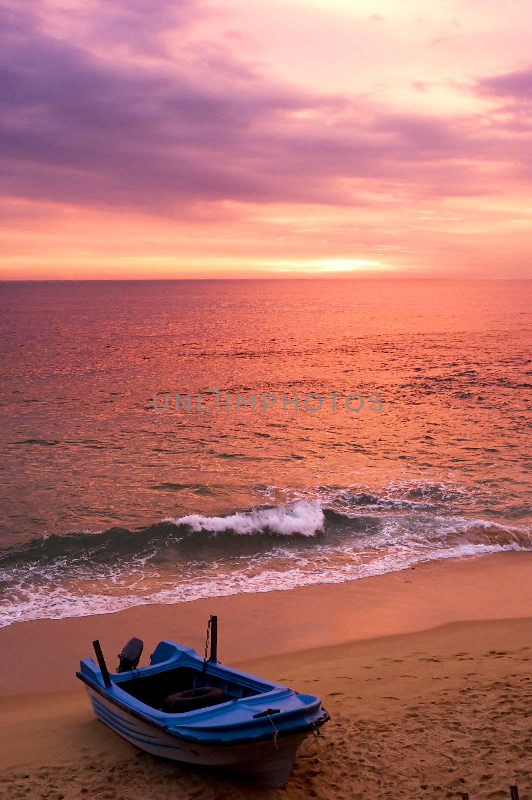 Boat on the beach at sunset. Sri Lanka