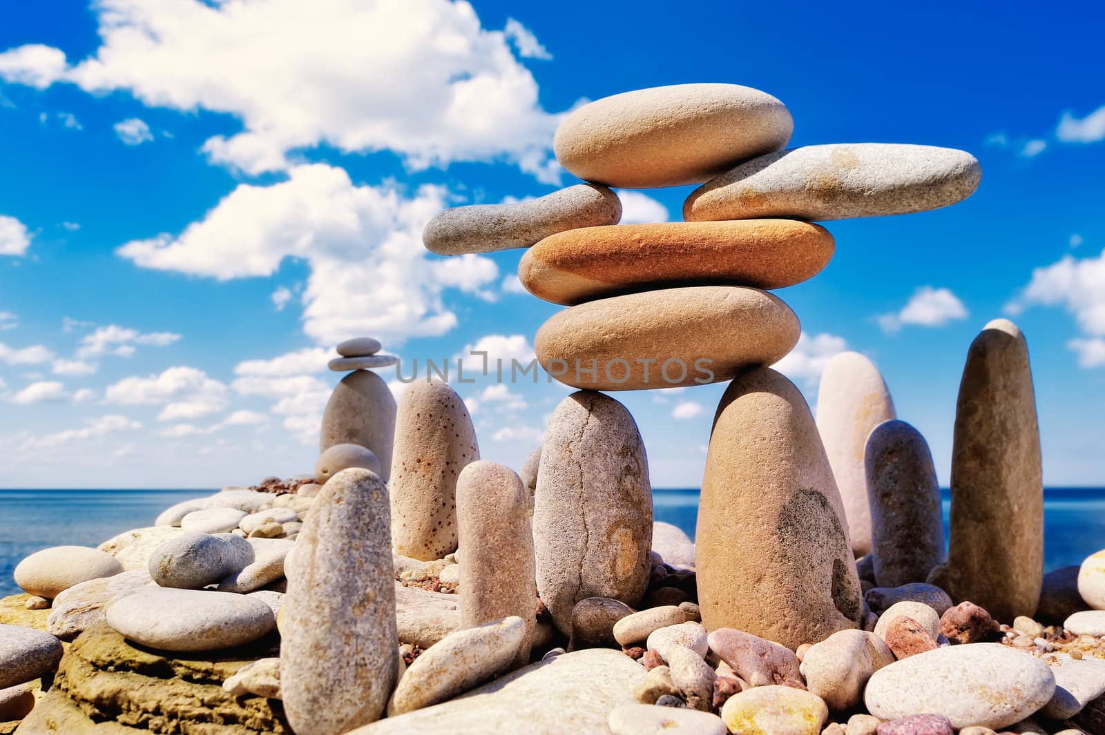 Group of some long cobblestones against the cloudy blue sky