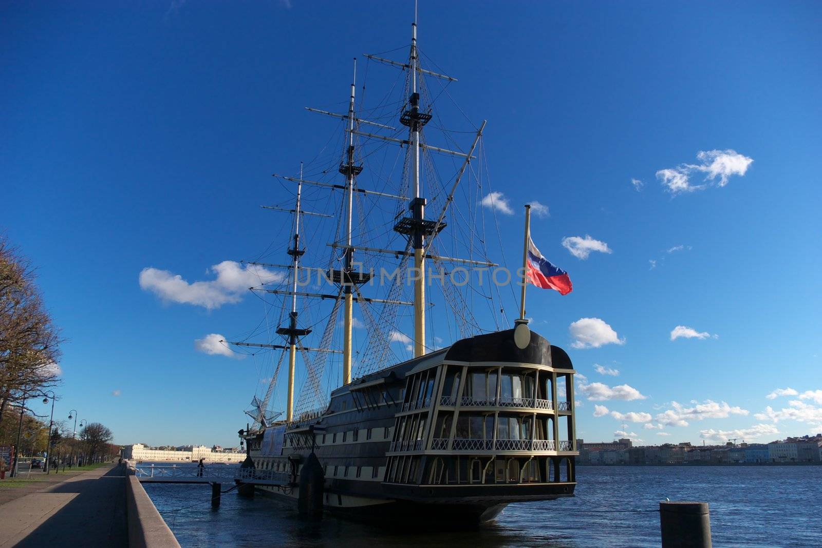 sailing ship standing beside coast on river Neva