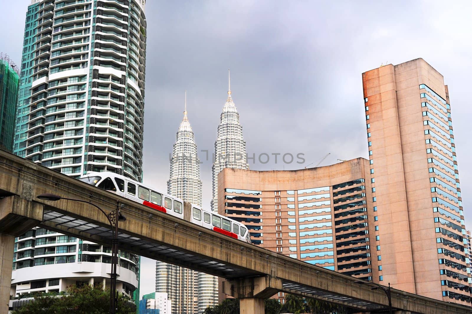 Cityscape with metro and high office buildings in Kuala Lumpur, Malaysia