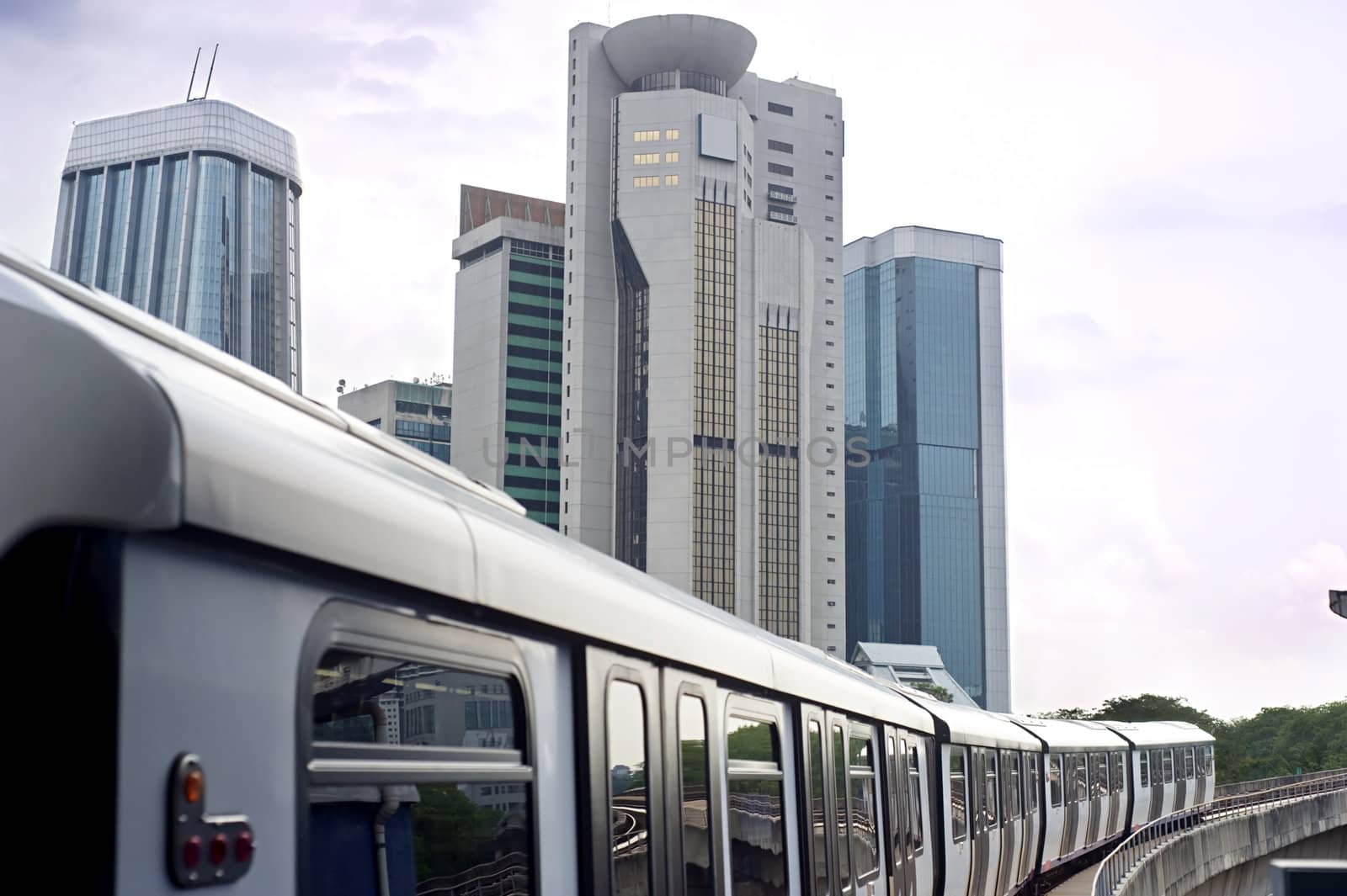 Cityscape with metro and high office buildings in Kuala Lumpur, Malaysia