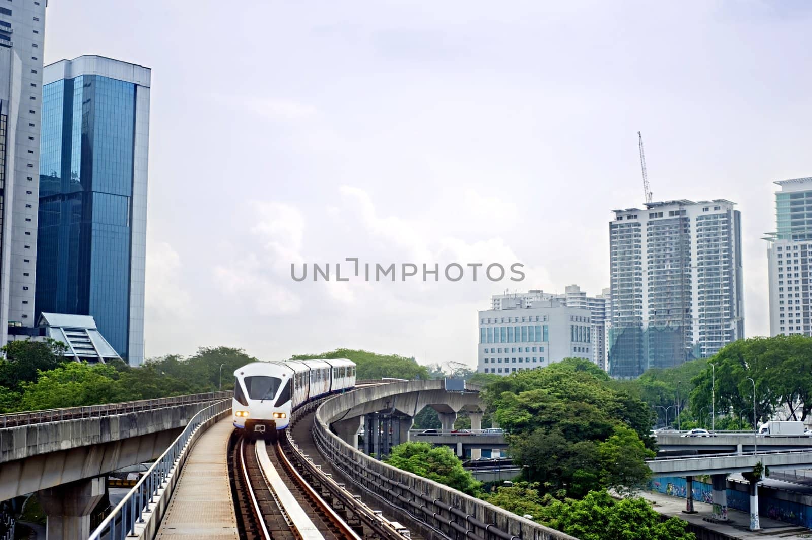 Cityscape with metro and high office buildings in Kuala Lumpur, Malaysia
