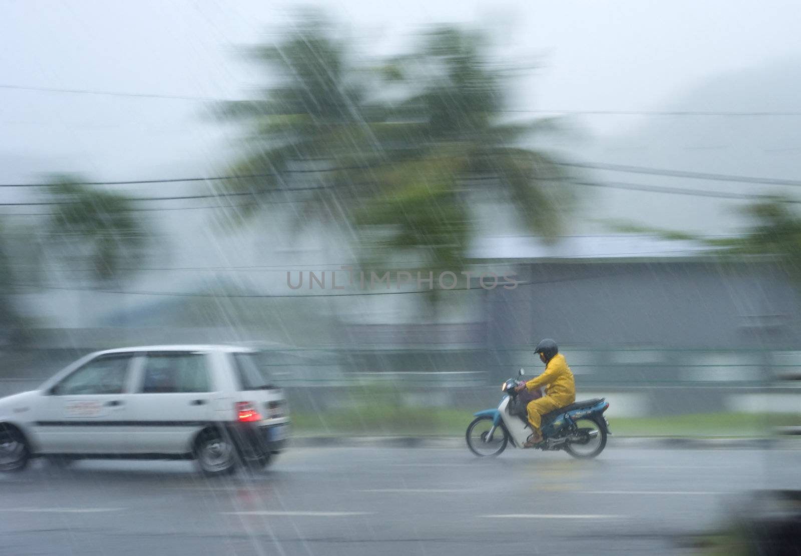 Kedah, Malaysia - March 28, 2011: Traffic in the heavy rainfall in Malaysia