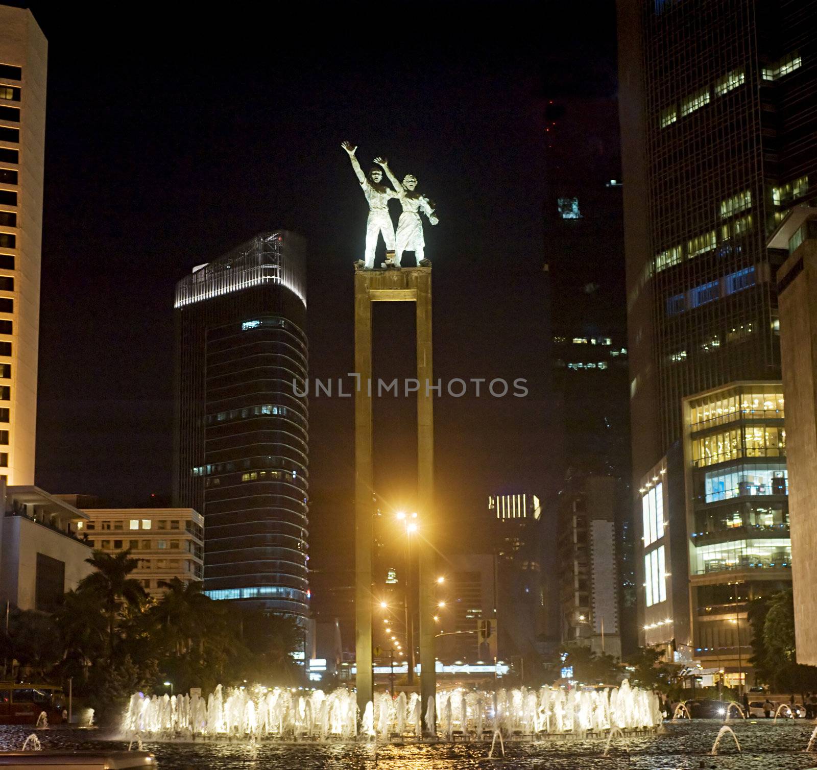 The bronze welcome statues stands high above a busy roundabout in Jakarta, Indonesia