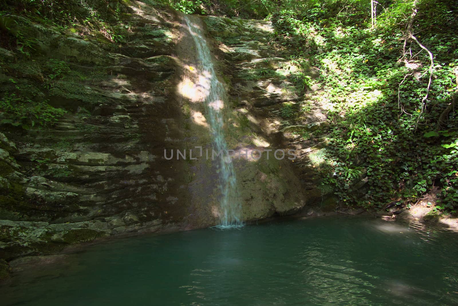 photo of the beautiful waterfall in tropical forest