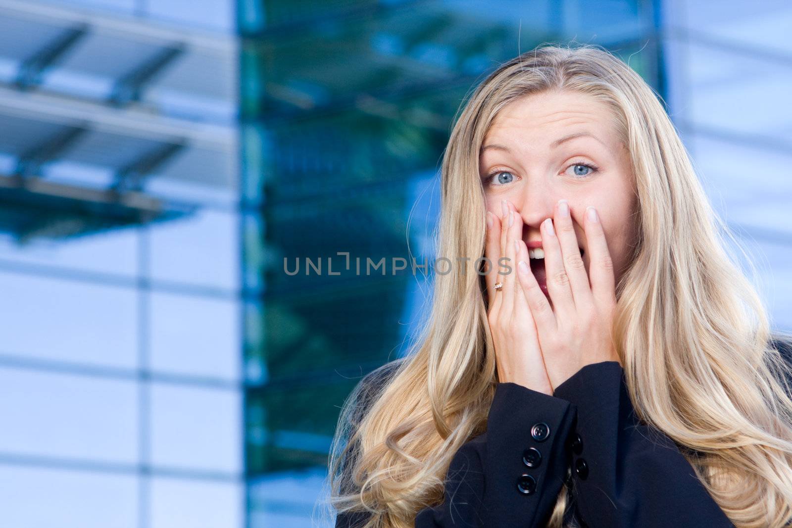 Excited business woman with ecstatic expression being joyful and happy