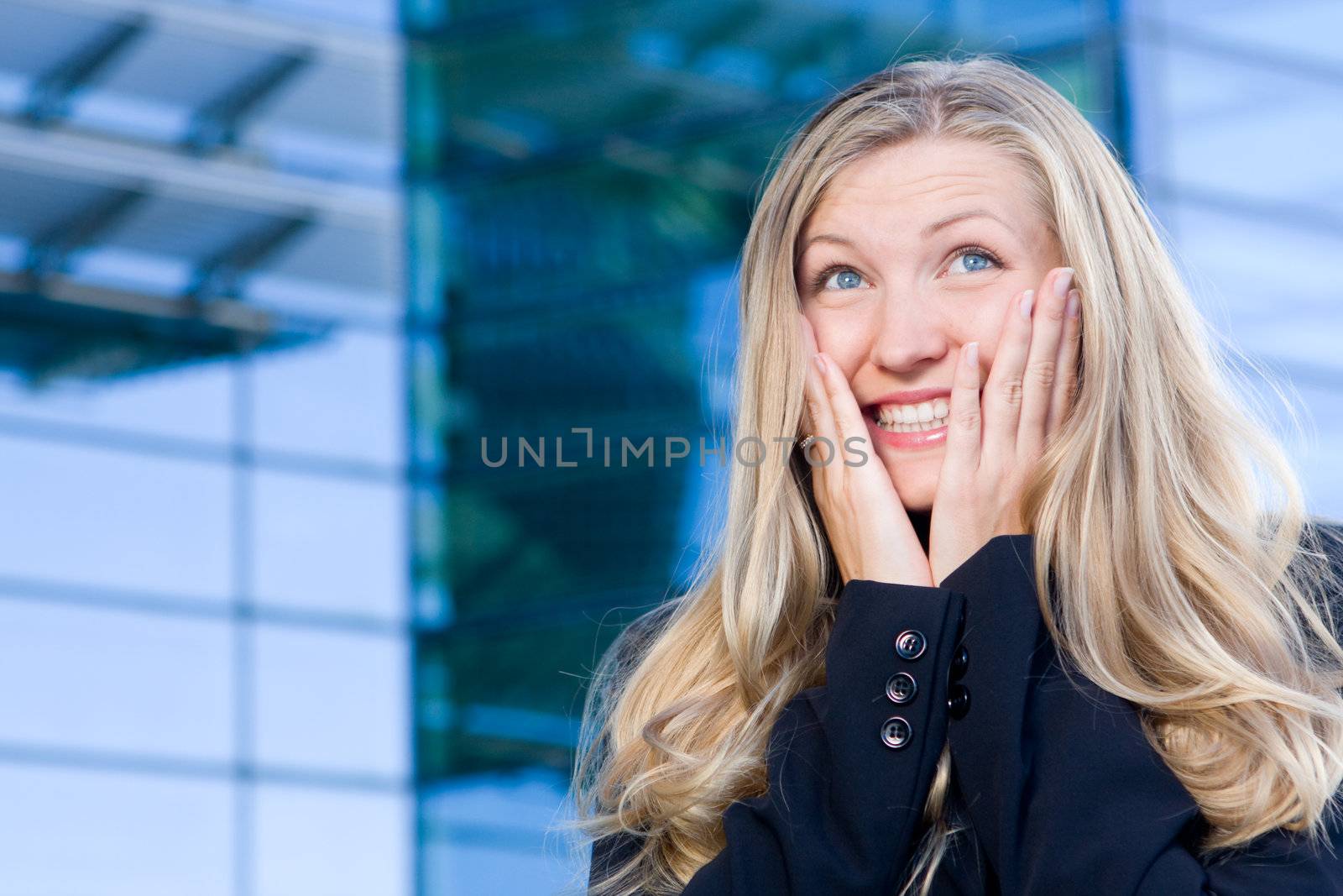 Excited business woman with ecstatic expression being joyful and happy