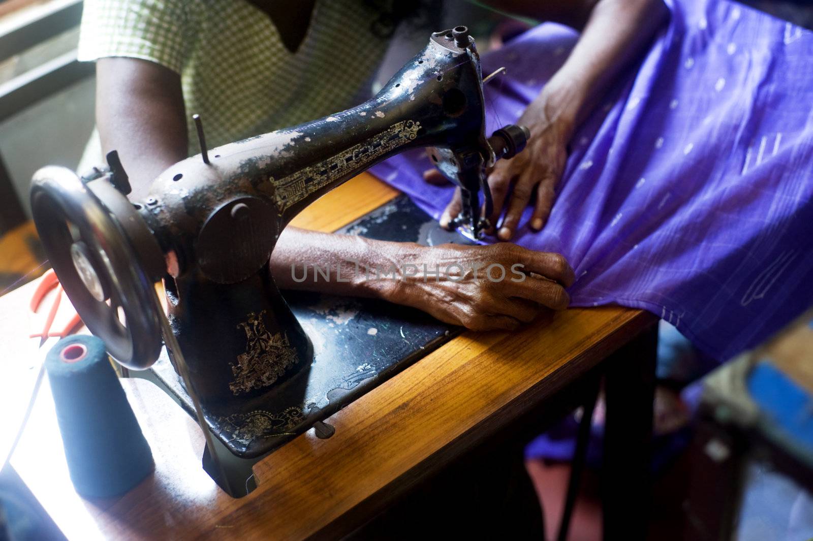 Sri Lankan tailor making new clothes