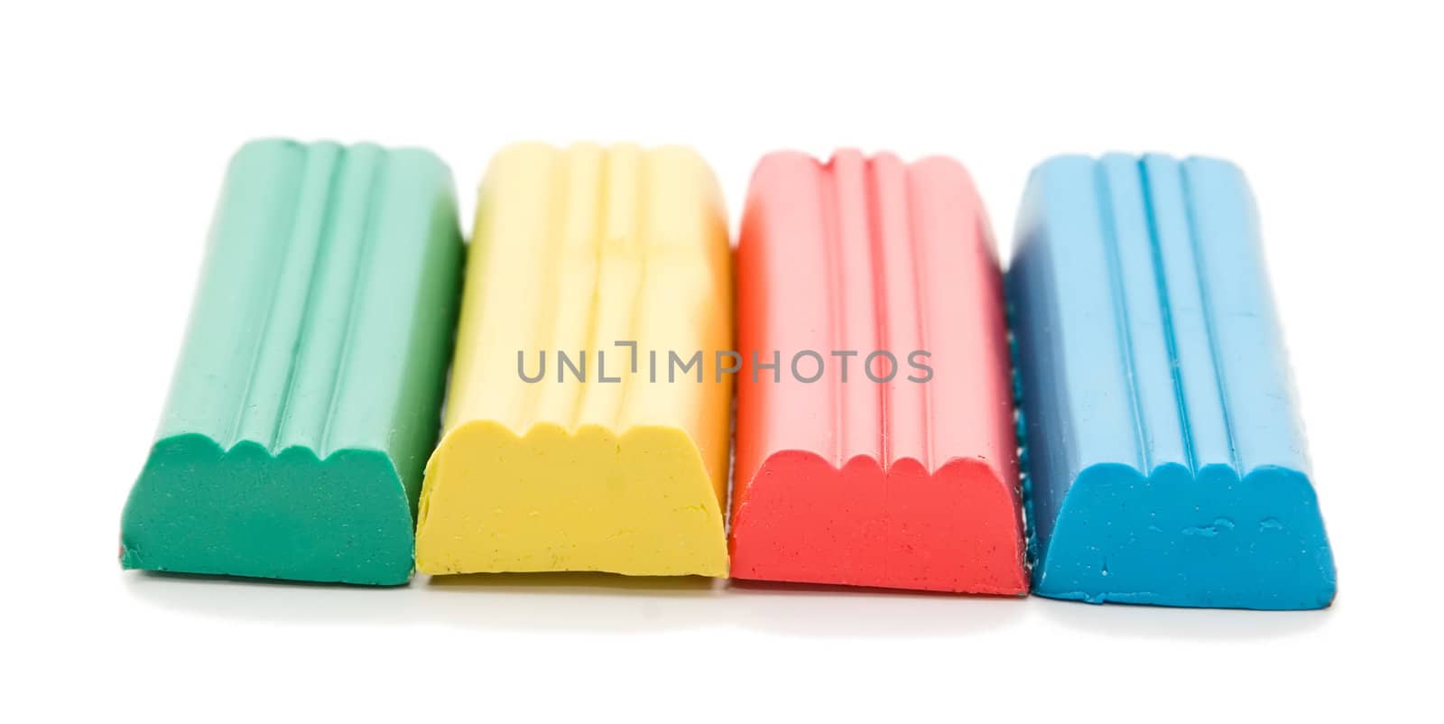 Close up of four clay blocks on white background