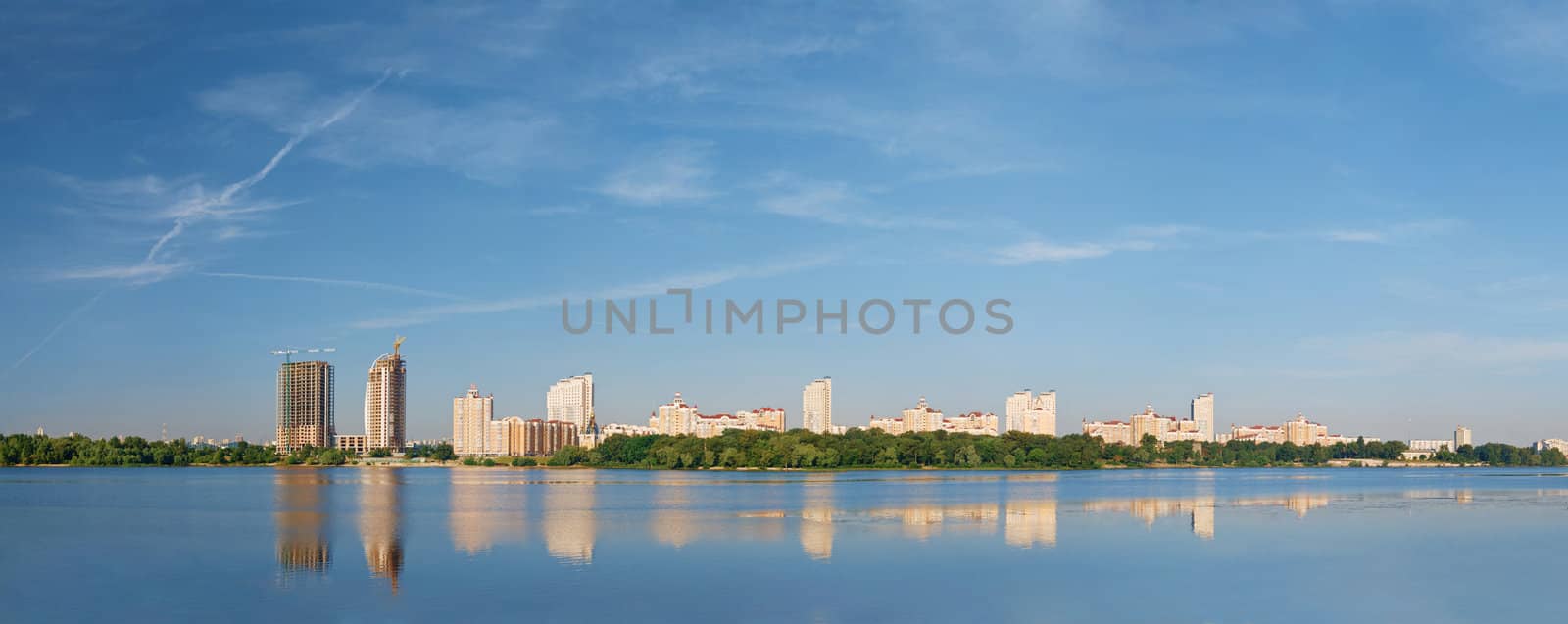 Panorama of Kyiv modern district Obolon with beautiful clouds