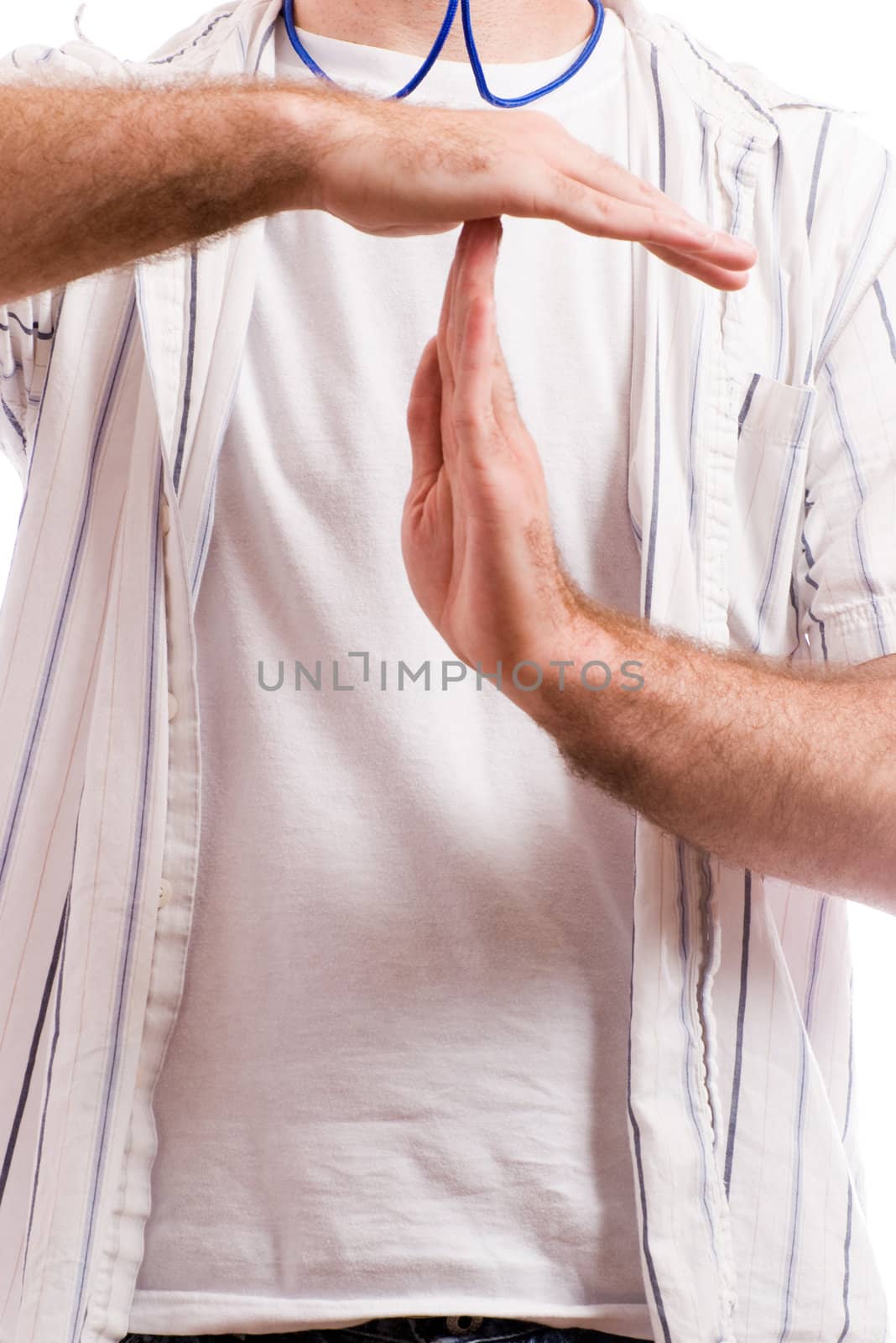 Closeup view of an informal coach giving the sign for a timeout, with additional copyspace underneath