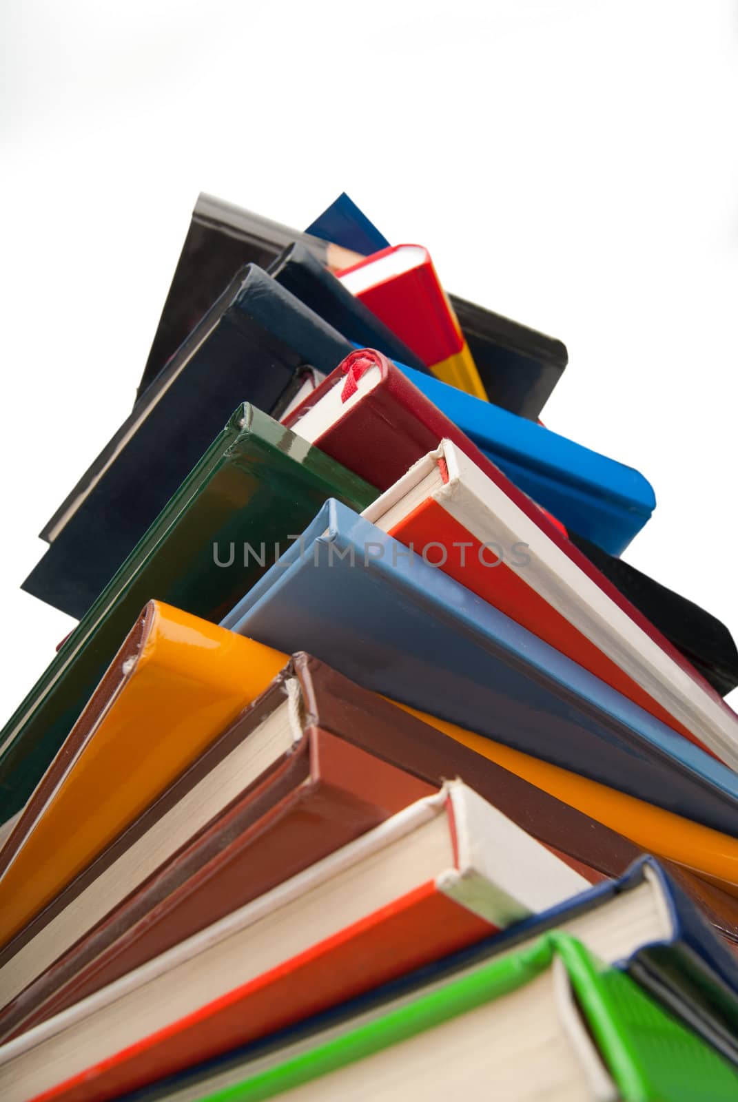 Used books stacked one over the other isolated on white