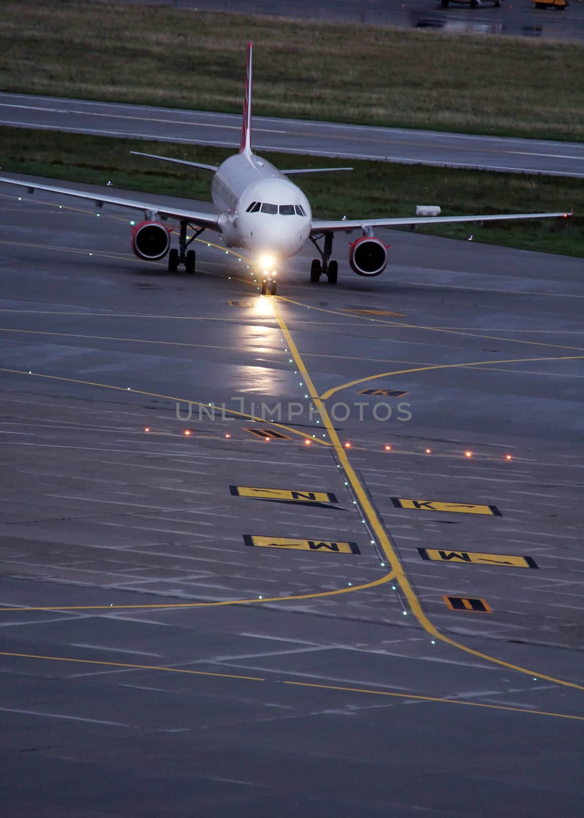 landing plane on the airport in the afternoon