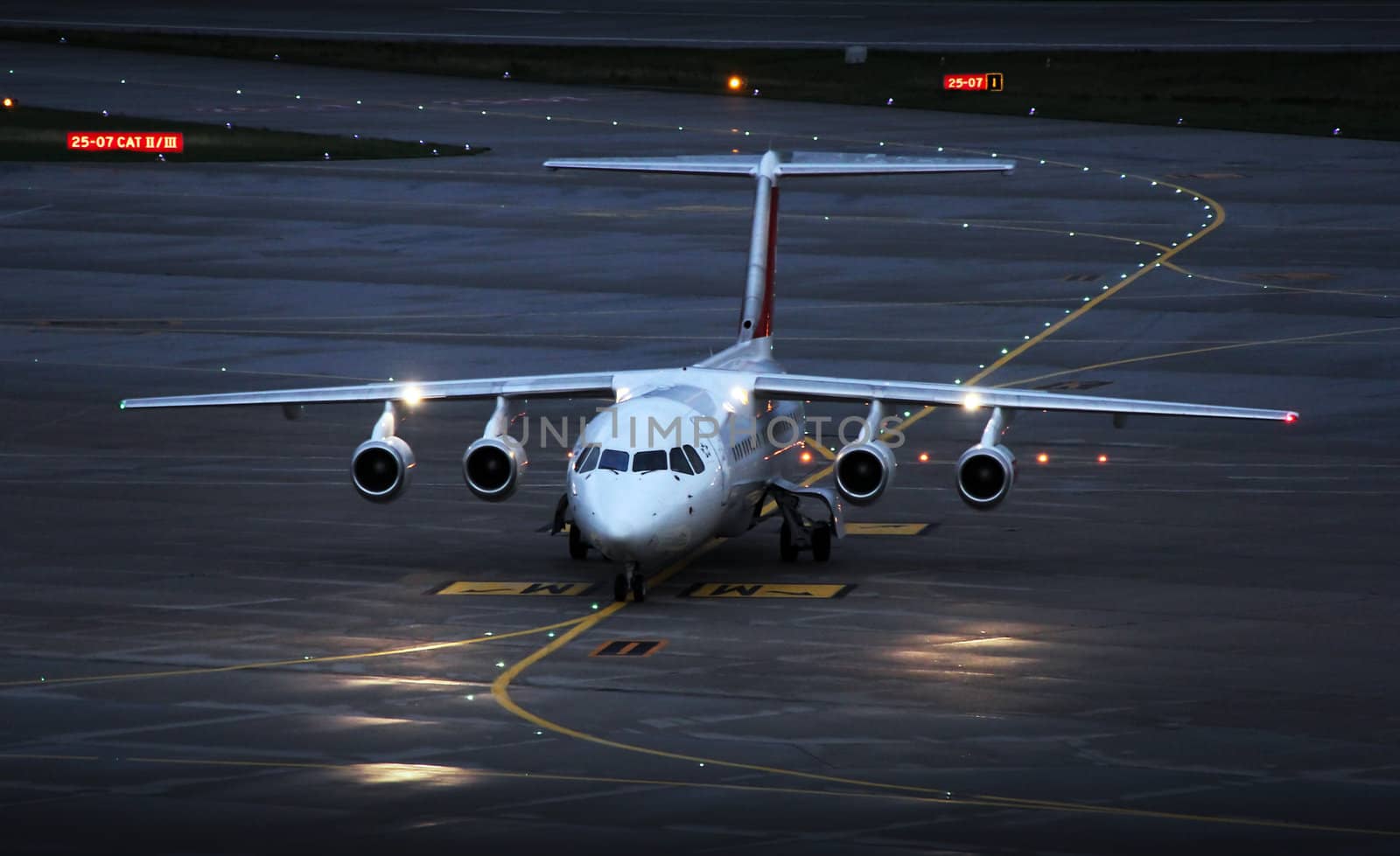 landing plane on the airport in the afternoon