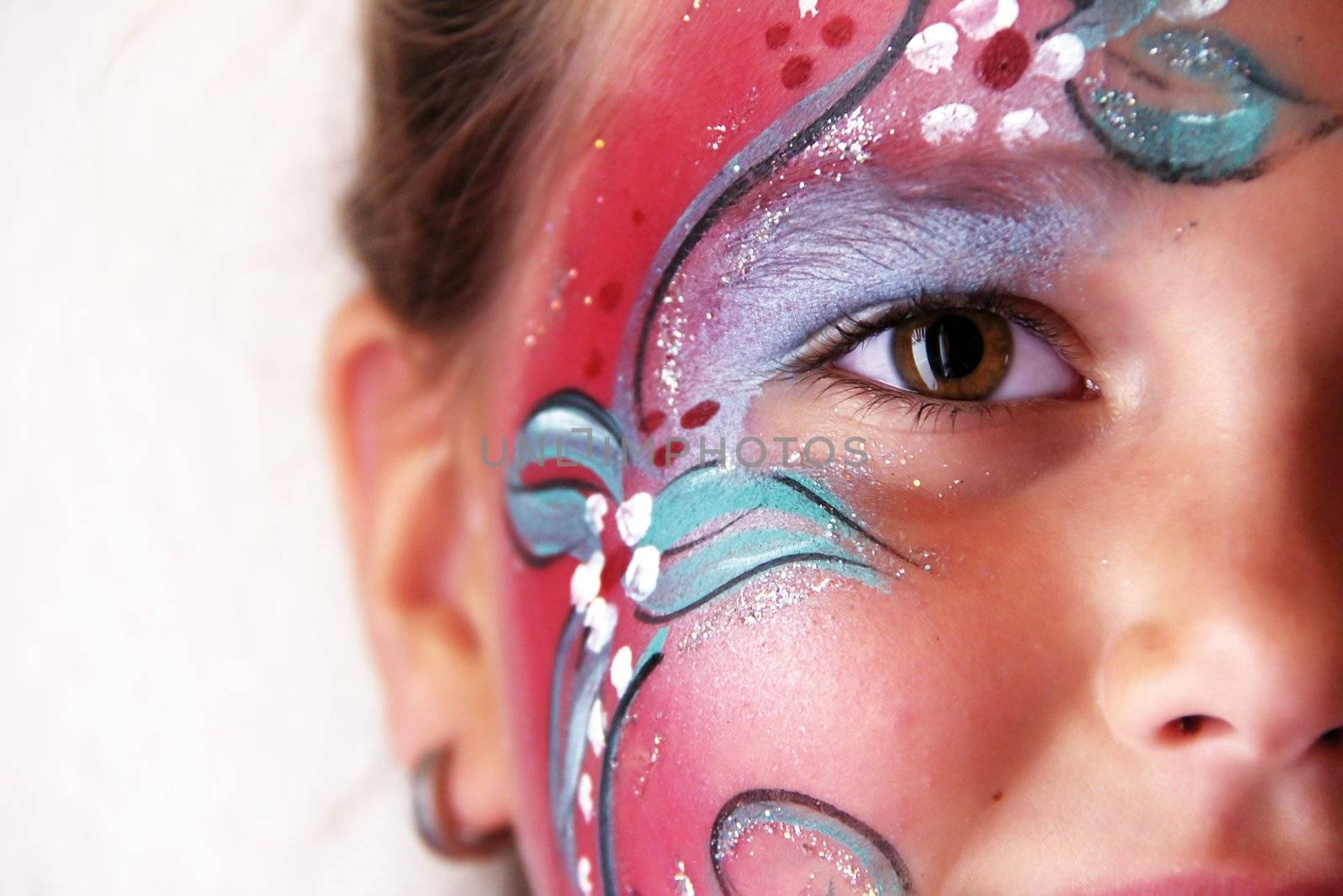 little girl with body painted flower face