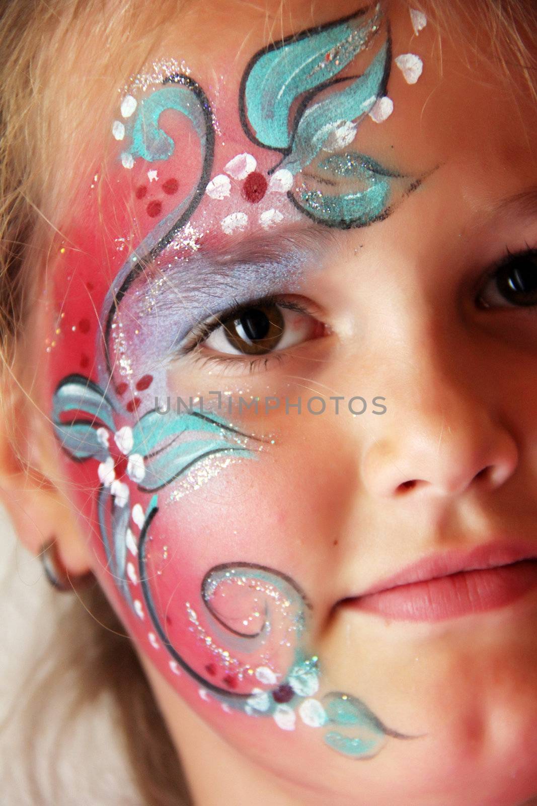 little girl with body painted flower face