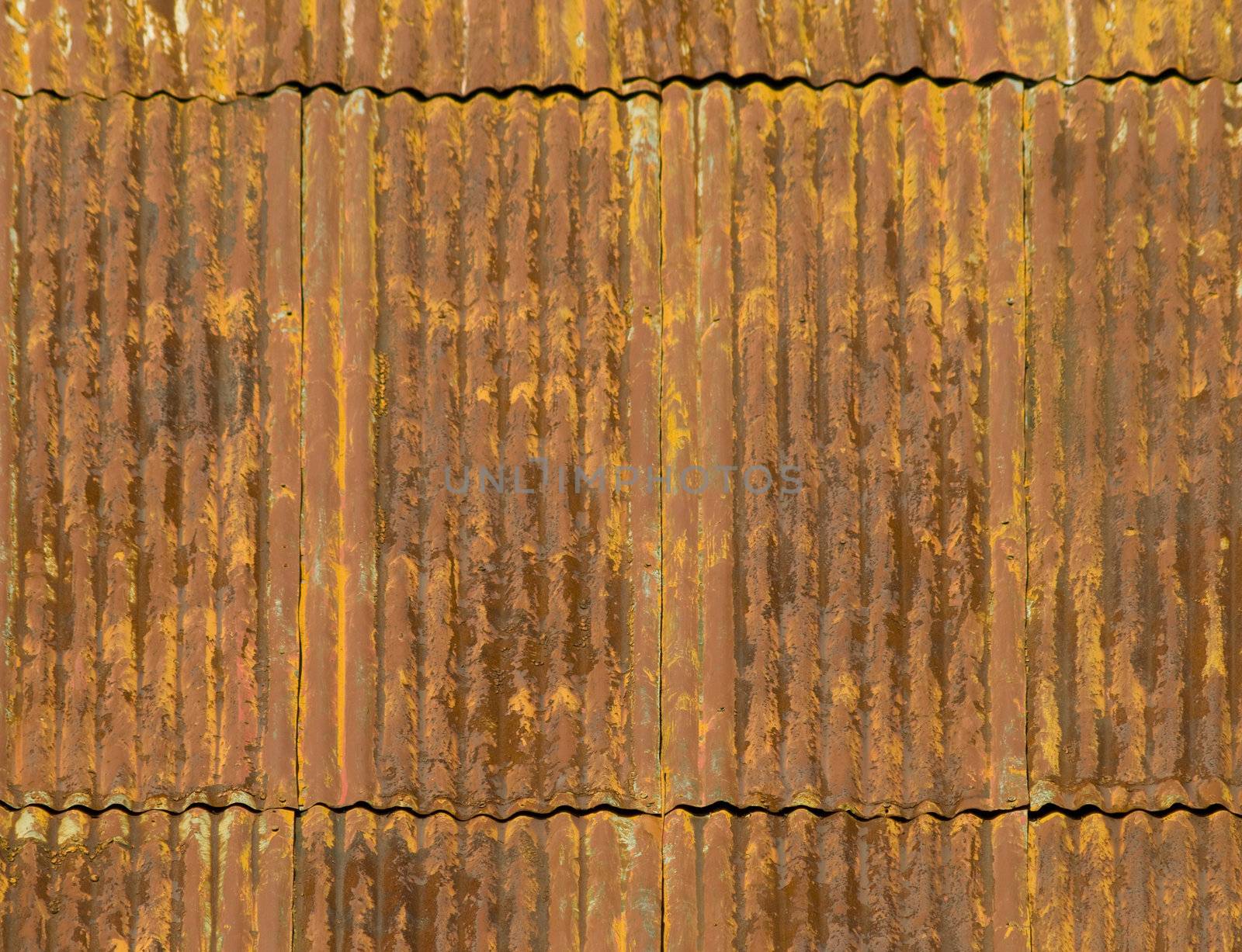 Corroded and rusty corrugated metal roof panels