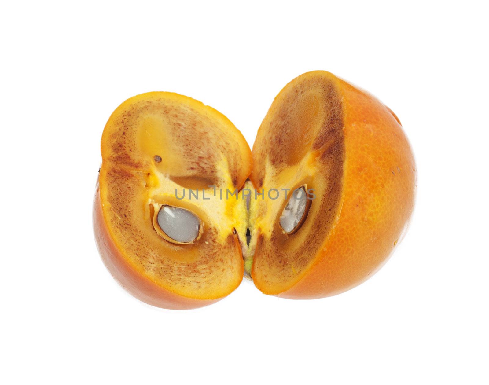 Two ripe halves of a persimmon