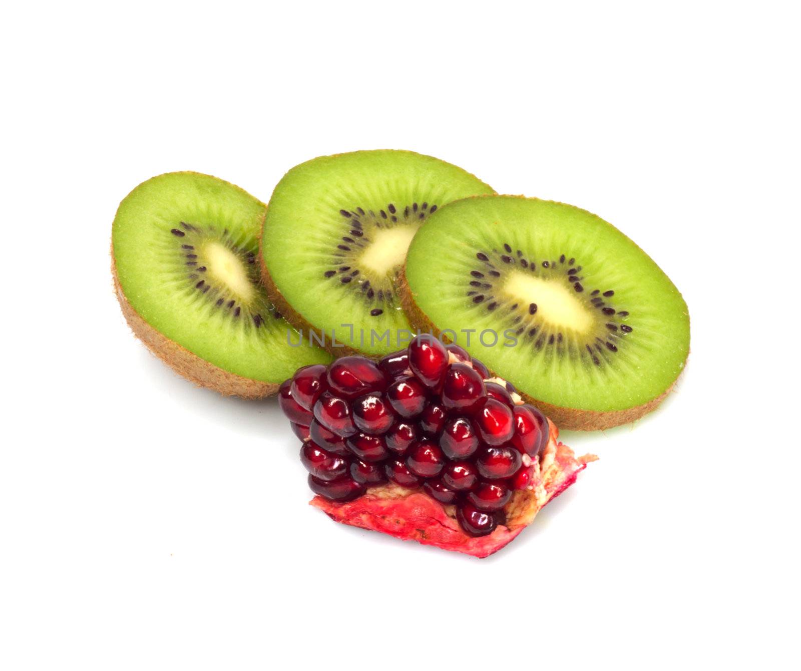 kiwi with pomegranate grain on white 