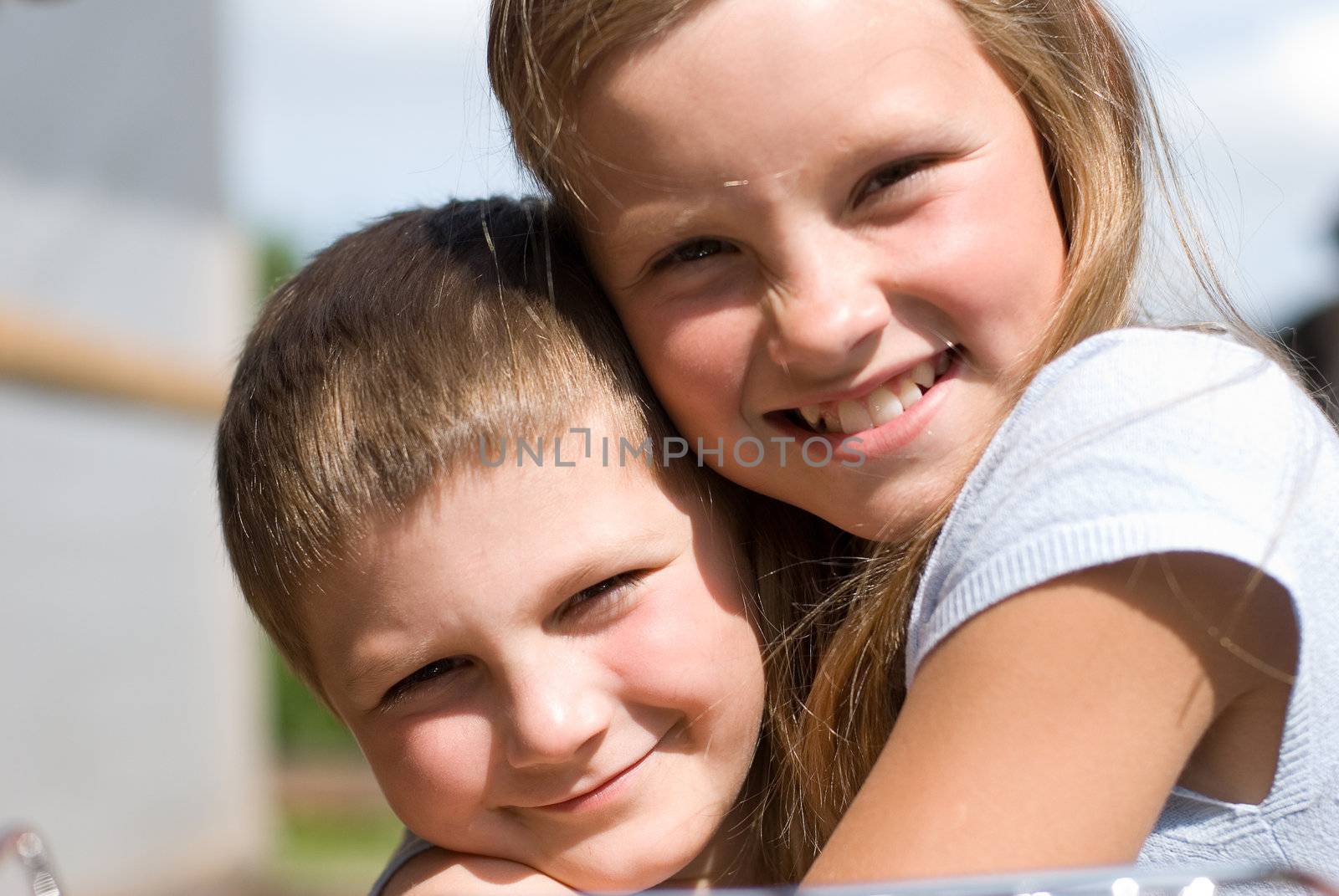 The brother and sister on summer vacations.  A warm sunny day in village