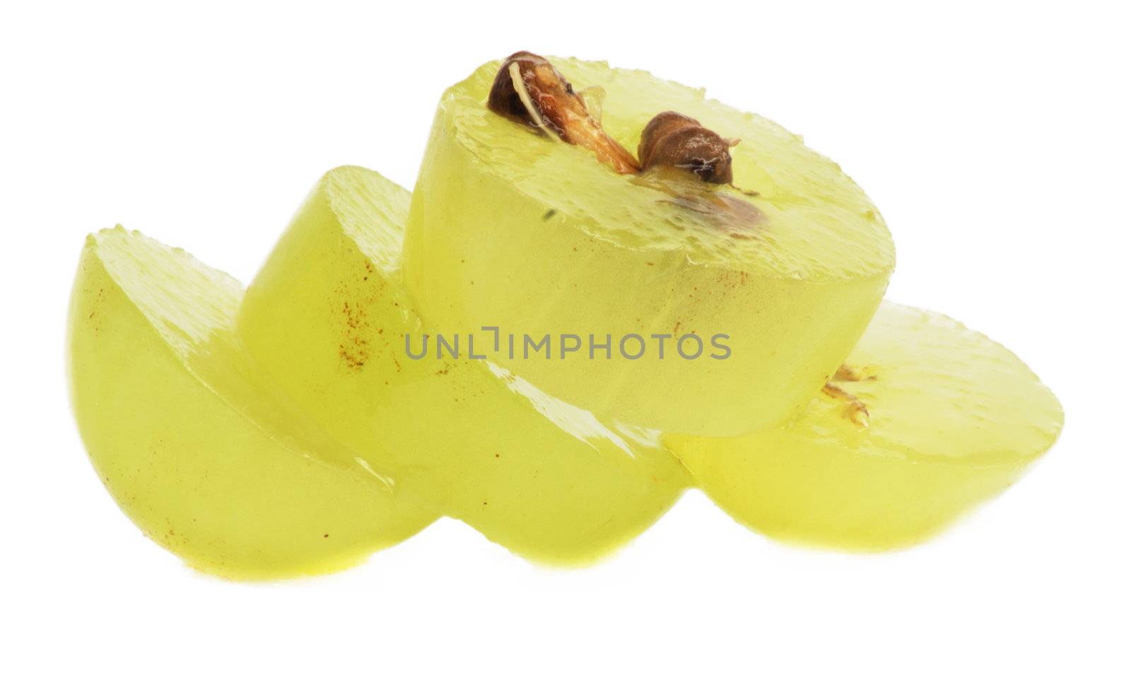 Translucent slice of green grape fruit, macro isolated on white  by schankz