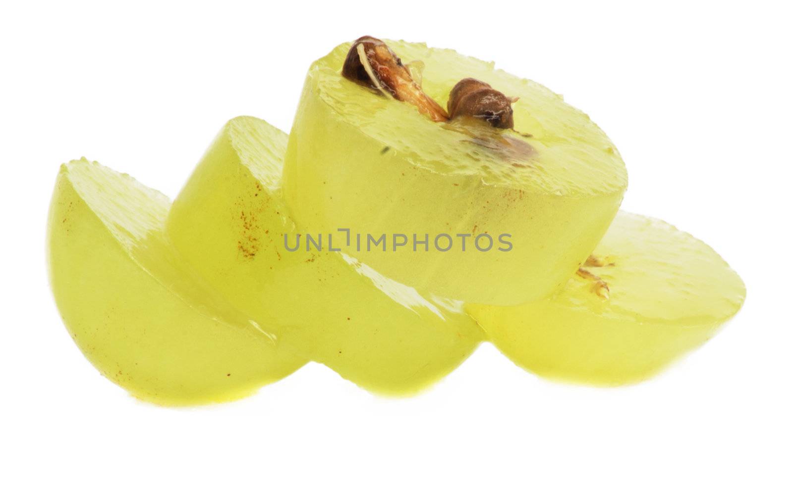 Translucent slice of green grape fruit, macro isolated on white 