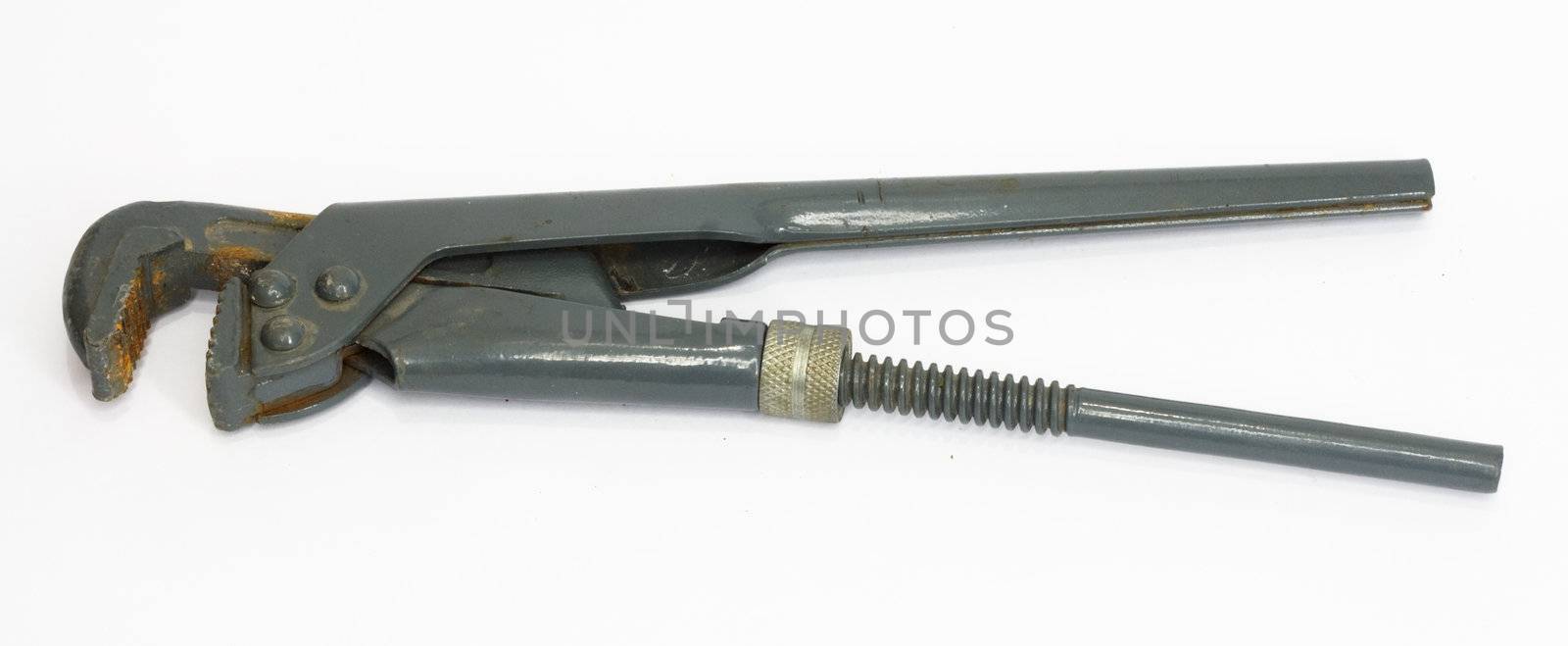 old adjustable spanner under the white background 