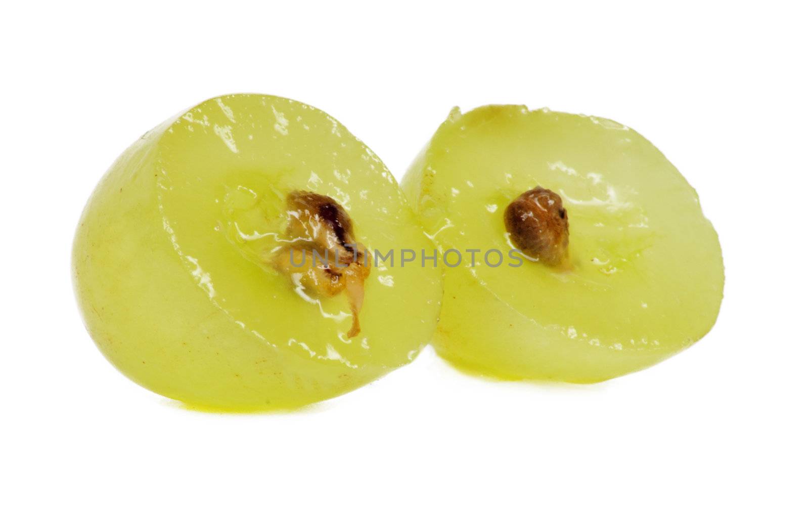 Translucent slice of green grape fruit, macro isolated on white 