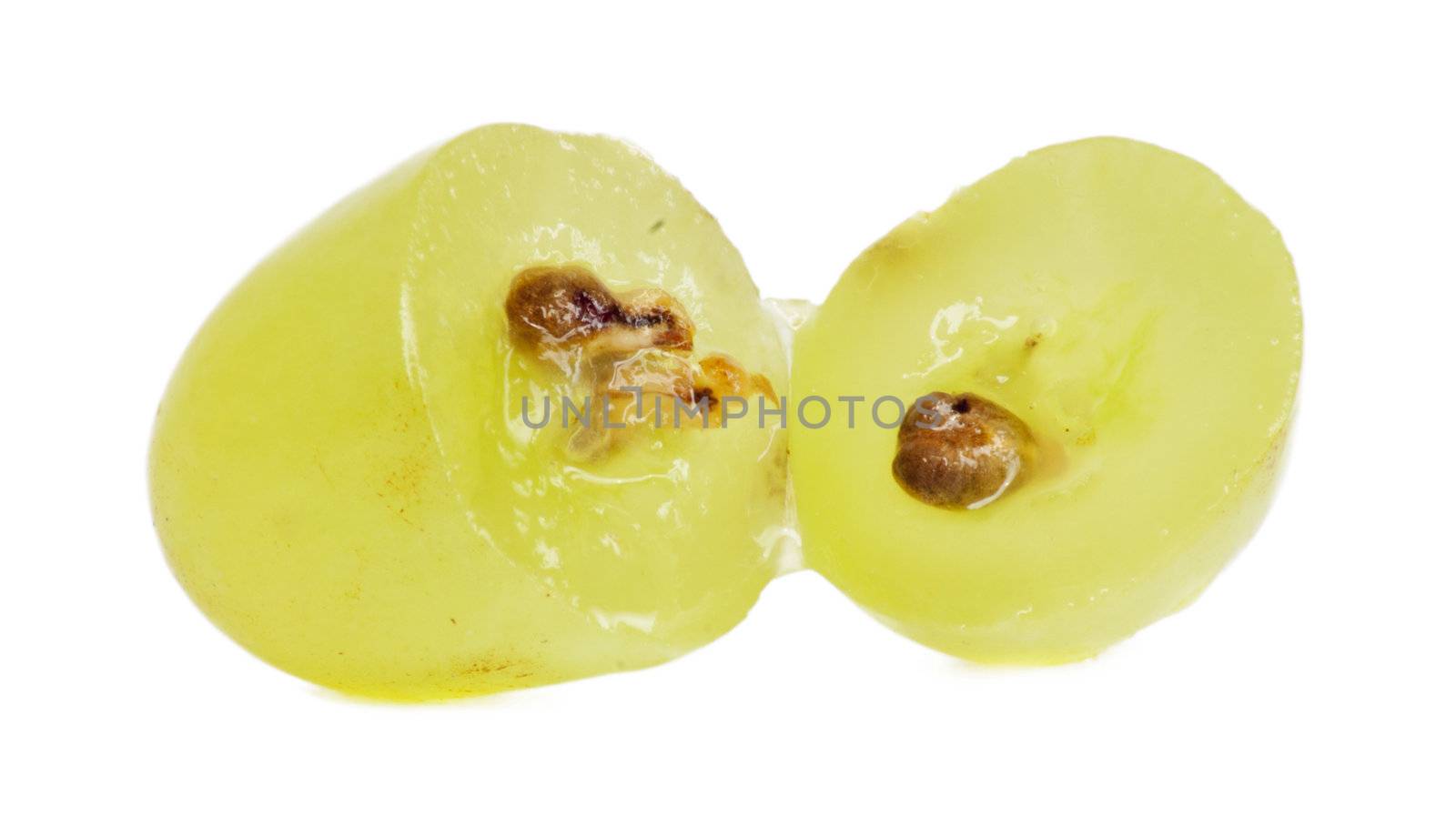 Translucent slice of green grape fruit, macro isolated on white 