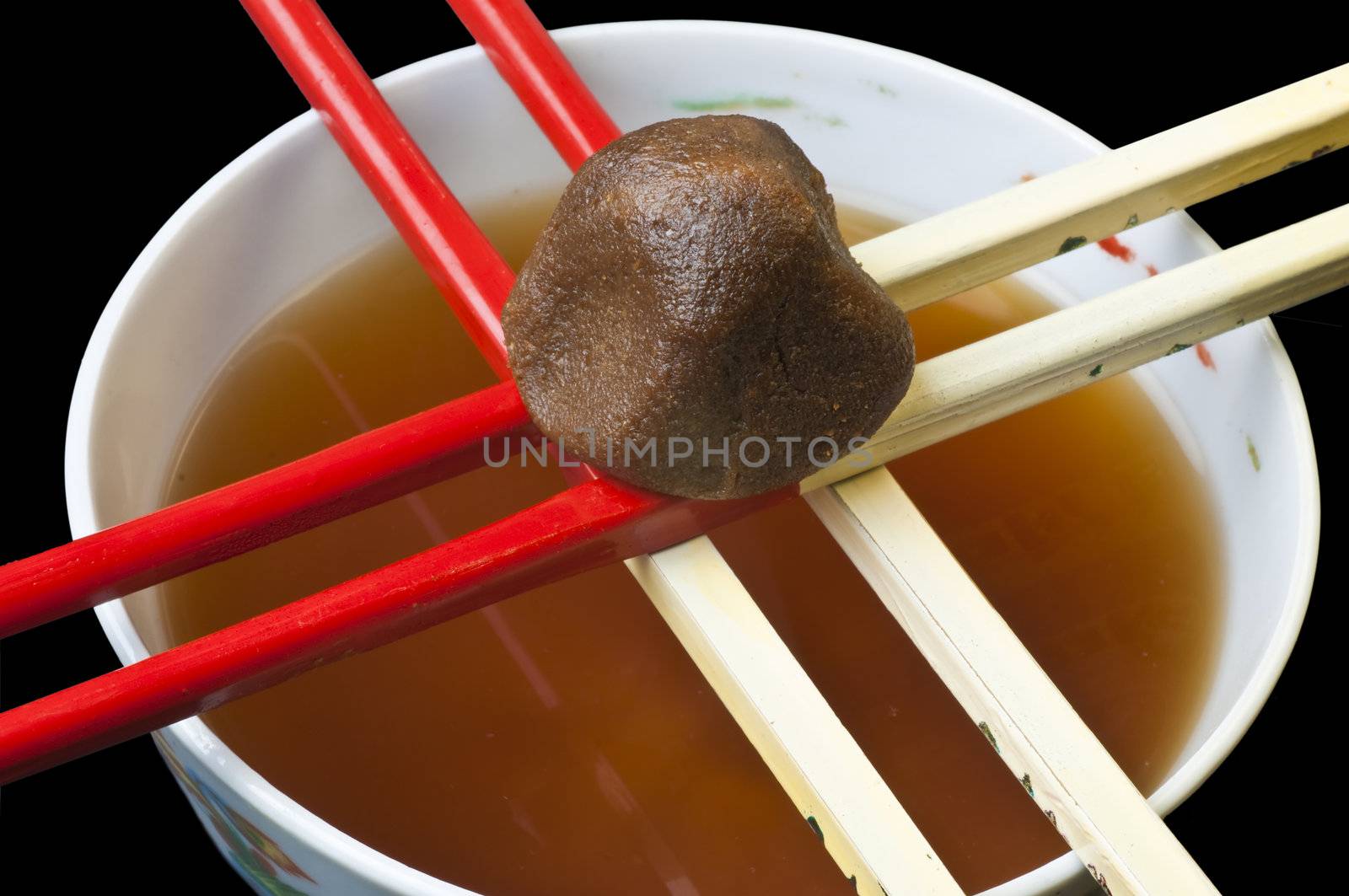 miso soup with miso and chopsticks