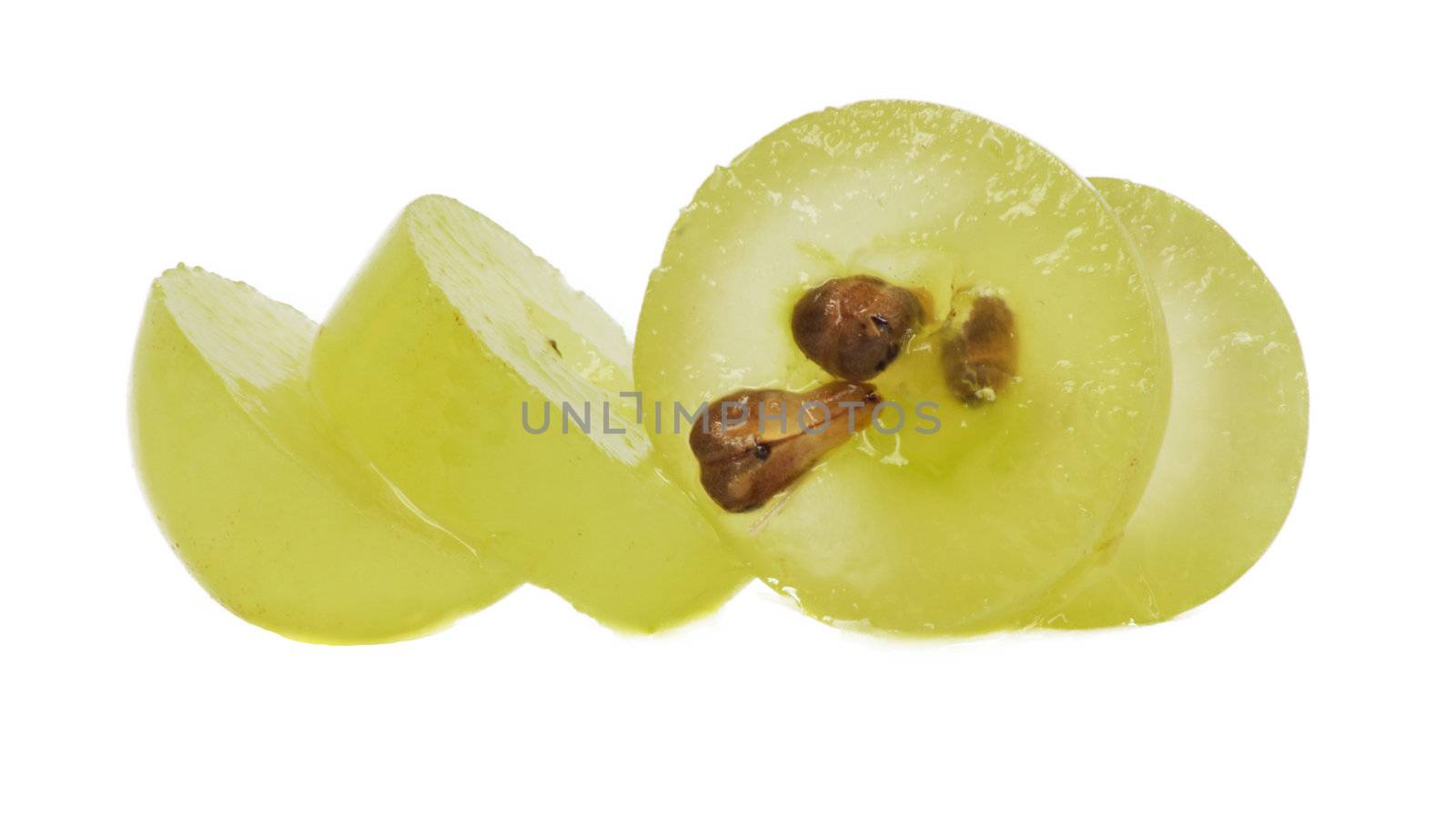 Translucent slice of green grape fruit, macro isolated on white 