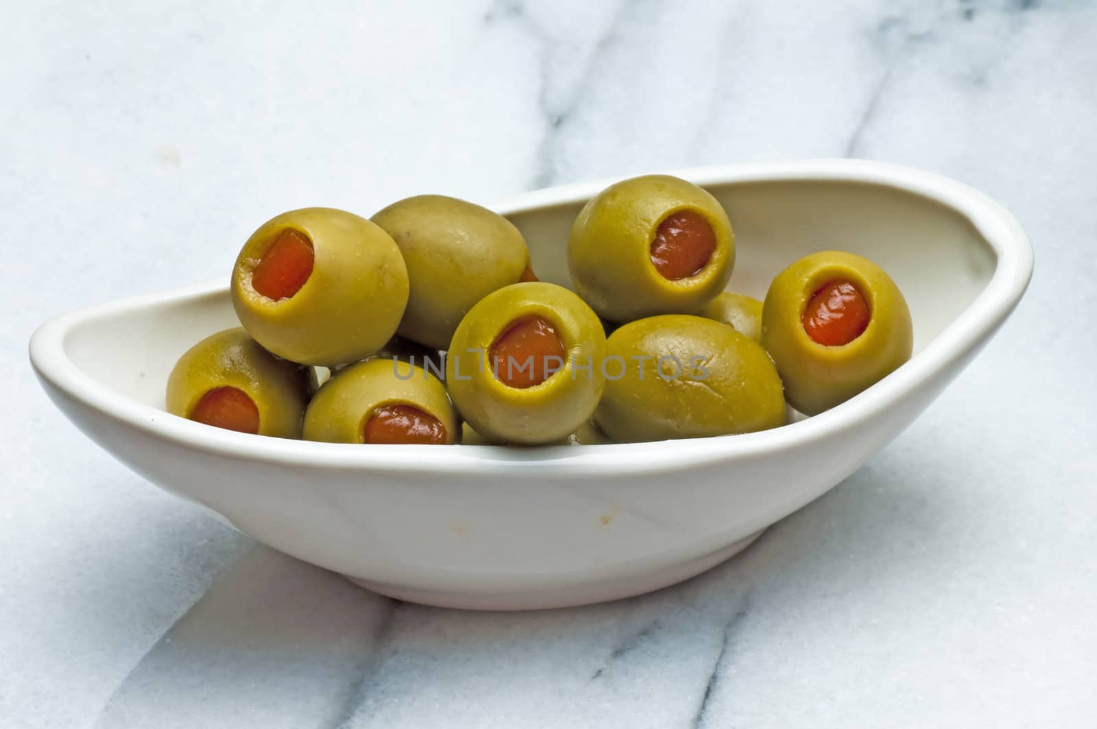 olives filled with red paste by Jochen