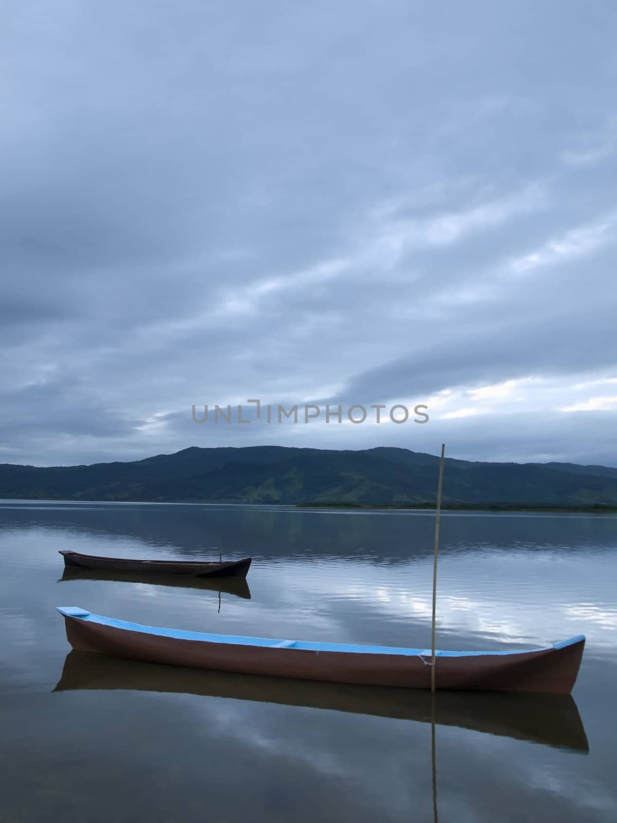 Tow boats at a lagoon at the early morning.