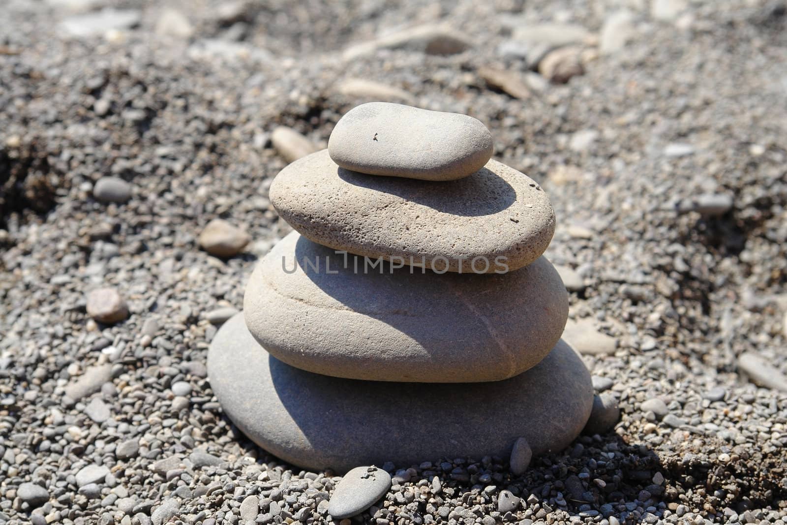 pyramid built from  stone on the beach                               