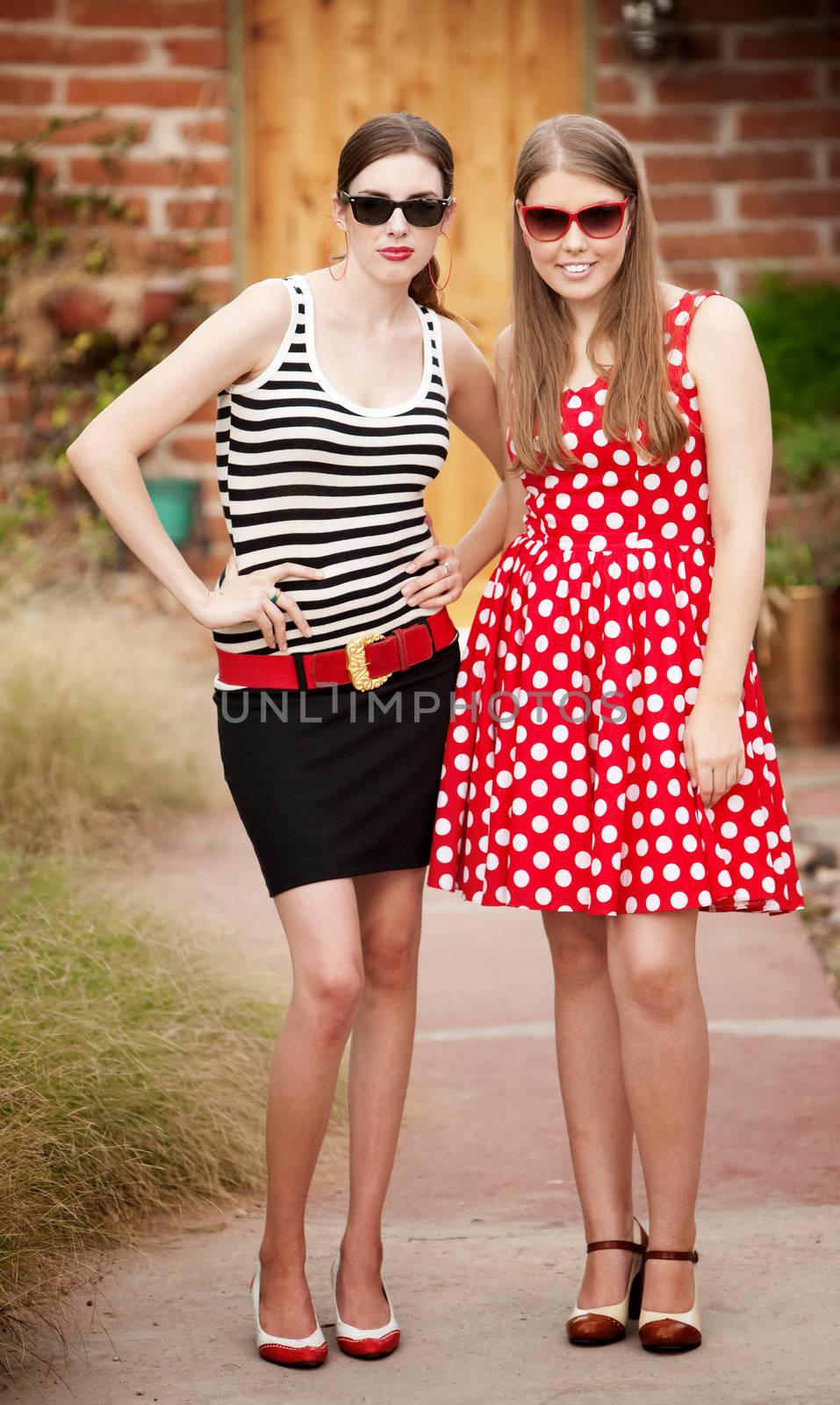 Fashion Girls on Walkway in front of House