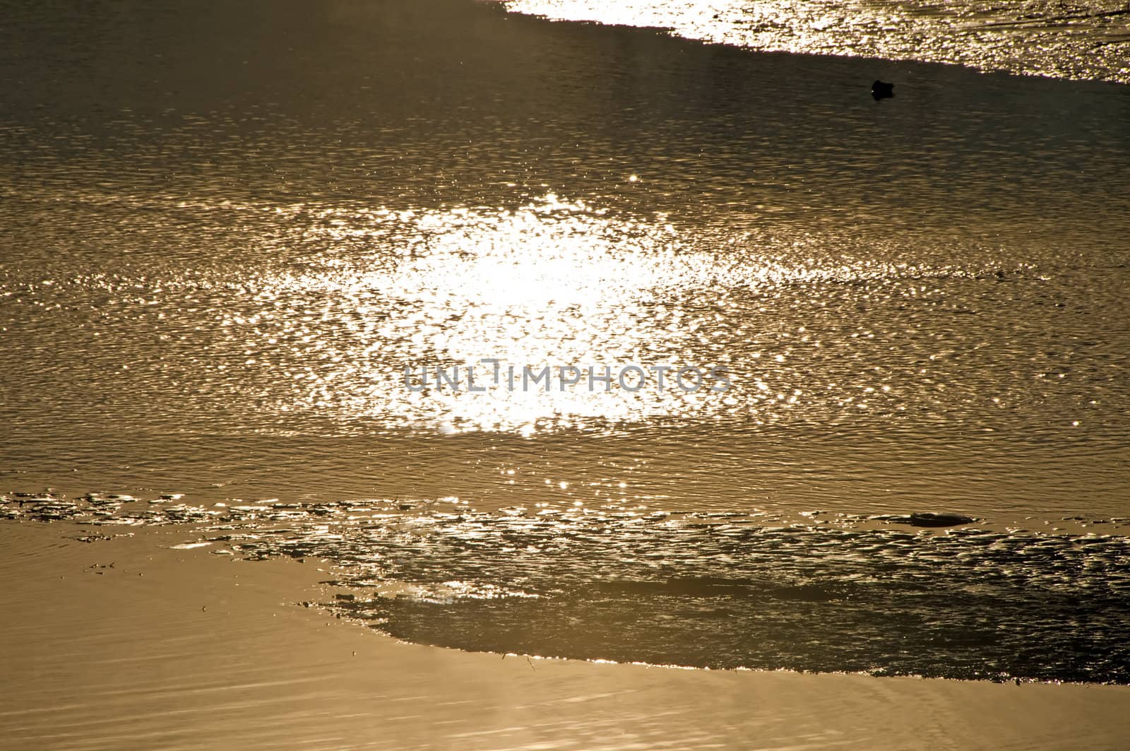 glittering lake in morning sun