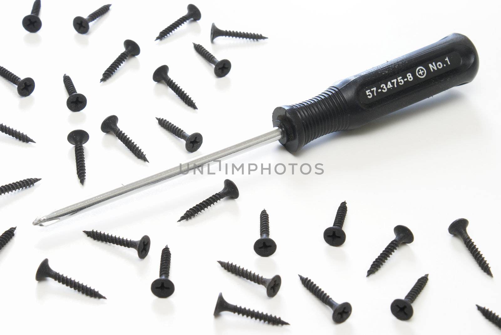 A starhead screwdriver with starhead screws on a white background.